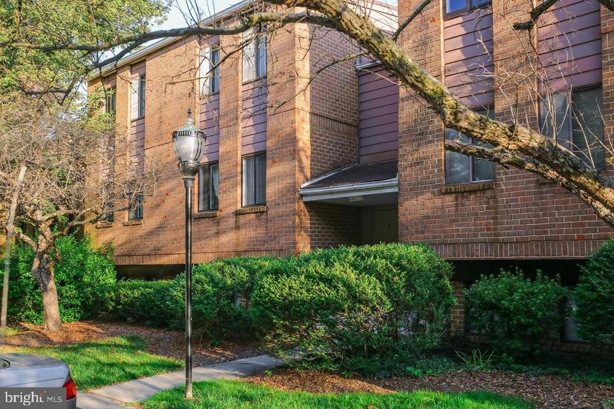 Bright and airy penthouse condo with a spacious balcony offering that relaxing outdoor space you've been searching for.  Enter into the foyer and find one of the numerous large closets. The living room and dining room feature soaring cathedral ceilings and beautiful hardwood floors and seamlessly connect to the open kitchen that has modern appliances, including a gas range and over-the-range microwave. The living room has a wood-burning fireplace (not in use, behind the TV cabinet), and the dining room has sliding glass doors to the large balcony overlooking a serene view.  This unit has two bedrooms and two baths (one ensuite). Both bathrooms have been tastefully updated—one with a relaxing tub and the other with a custom shower. There is an all-in-one washer/dryer combo in the unit, too! The community offers great amenities, including a community pool, wading pool, and picnic area, and the association fee even covers the gas (heat and cooking!), water, grounds maintenance, and trash. This location is conveniently located to Quarry Lake with easy access to I-83 and 695. This condo combines comfort, style, and convenience at an affordable price. Schedule your appointment today. It will not last long.