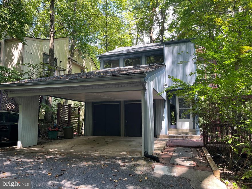 Situated on a wooded bluff overlooking Sligo Creek Park this cul-de-sac home is a hidden gem that most that pass by and are not aware of. The park with miles of trails along the creek is just a few steps away, and you are in the City of Takoma Park, not unincorporated Silver Spring!  This home has interesting contemporary architecture and offers 3 levels of finished space including a walk-out to level basement.   With 4BR 3.5BA it's a good-sized home with room to spread out!  Entertaining is easy here with a custom tiled entrance hall with a half-bath, leading to a large open plan dining room with lots of custom cabinets for many dining sets, recipe books, and a step-down living room with a wood-burning fireplace and sliding doors to a balcony with tree views.  All-new oak hardwood is featured in the dining, living, and kitchen rooms. The kitchen corian countertops and white cabinets gleam and recent appliances including a dual gas/electric oven and large refrigerator present a good working triangle with lots of counter space. There's a delightful breakfast nook here beside the window with a flower box.
As you climb the stairs to the top floor, note the new hardwood treads and the convenience of a washer/dryer tucked away off the upper hallway that is flooded with light from a skylight window.  The extra-large owner’s suite is very special, with a cathedral ceiling, and an updated en-suite, marble-tiled bathroom with a spacious walk-in shower, and very own private deck - set in the trees.  Morning coffee on days off just got better here.  The floors here are new oak hardwood and the paint is new throughout the house.  There's a new ceiling fan light and there are ceiling fans in the kitchen, living room, and all the upper bedrooms).  There are two wall safes in the rear of the owner-suite closet. The two other well-sized bedrooms have new carpeting and an unusually large amount of closet space.  The upper hallway and all bedrooms have custom bookshelves.  Many more custom-built shelves are on the main and lower levels! If you love books, you will want this house! There's also another updated upper-level hall bathroom with a tub/shower.  Step downstairs to the rear patio level and there is a full bath with tub/shower, a 4th BR/Office leading to a separate side entrance (in-law suite potential), and a big Recreation Room with more custom shelving and a level walk-out to the lower-level patio via sliding glass doors.  There's a utility room with additional refrigerator/freezer and storage shelving.   A spacious wooden deck off the main level is ready for your next BBQ or birthday party.  
There's parking for 2 cars under the front carport and another 3rd car to the left of that, and you can add a couple more in the driveway for parties.  A big storage shed is usefully placed at the back of the carport, and there is an enclosed structure for trash cans across the driveway. Economical gas heating is combined with electric Central Air Conditioning and the water heater is almost new.  This is a low maintenance treed yard with no grass cutting needed - just once a year leaf cleanup.  The park below us an extension of your yard! Stroll to the entrance of the cul-de-sac and you are in Sligo Park with miles of trails, yet you can walk to Takoma Park City Town Hall and Library.  Schools are nearby.  Takoma Metro Station is a little over a mile away, along with Old Town restaurants and shops.  It's a short trip to Silver Spring Whole Foods and restaurants too. This home is an easy commute to downtown Washington, DC, the University of Maryland, Washington Adventist University, the I-495 Beltway, and I-95, along with all points in Bethesda.
This striking and unusual home has been carefully updated by the original owner who is ready to pass it to a new owner who loves a setting in nature with the convenience of close-in living and great neighbors. It's a must-see!  Open Houses Friday 9/6 6 pm to 7:30 pm, Sat., 9/7 2-4 pm, Sunday 9/8 1-4 pm