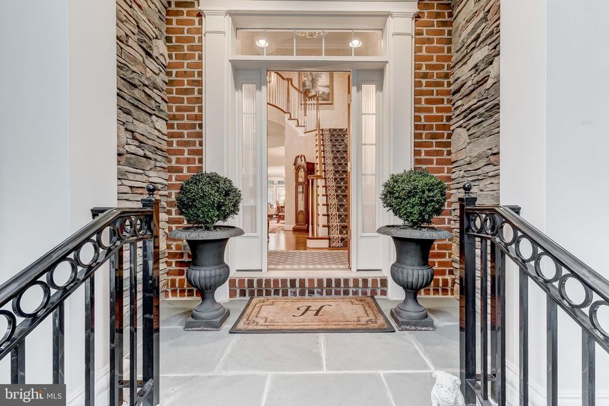 Luxury Townhome with exquisite architectural detail and finishes throughout. This 3 level home is beautifully appointed and meticulously maintained. Enter into a two story foyer leading to a very open floor plan with Brazilian cherry hardwood flooring throughout the main level. Gourmet kitchen with stunning granite counter tops and tile back splash with granite mosaic tile accents. Commercial grade Wolf 6 burner range and all top of line appliances, including two Sub-Zero wine coolers. Kitchen is open to Dining area and large Living Room with beamed ceiling,crown molding and columns to define space. Built in bookshelves,gas fireplace and Lutron recessed lighting for creating  any atmosphere you desire. French doors to deck with retractable awning overlooking conservancy area. Master Bedroom with sitting area, built in bookshelves and gas fireplace,designer carpeting, large walk-in closet and on suite Master Bath. Large second Bedroom and Bath and separate Laundry Room. Lower level Family Room with Built-in Bookshelves and gas fireplace, sliding doors to covered patio. Wet bar with granite counter top and raised panel pine cabinetry. Wall to wall carpeting throughout and third guest Bedroom with Bath. Two car garage and three stop elevator add to the easy living in this 5 star home. Conveniently located in Baltimore County Cloisters neighborhood. Brokers Open Wednesday July 24th, 12 -3