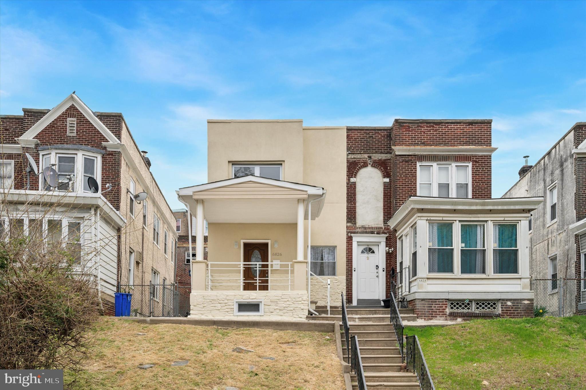 This light-flooded home overlooking a walking trail along Cobbs Creek (one of the Fairmount Park system’s best-kept secrets) hits all the marks: tasteful finishes, a primary suite, off-street parking and, on top of its already spacious floorplan, a finished basement. Set nicely back behind a true front lawn is the handsome facade with a stone front porch entrance. The first floor is flooded with light with two exposures from five large windows. The generous living and dining areas with oak floors are wide open to the large ceramic tiled L-shaped kitchen with ample Shaker-style cabinets and granite countertops with stainless steel undermount sink against oversized white subway tile backsplash and stainless steel appliances–Samsung dishwasher and five-burner range with convection oven, and Frigidaire fridge and microwave. Past here is a mudroom with access to a large powder room with laundry hookups and the large rear patio with steps up to the garage next to a retaining wall garden bed. Back inside and up the wide staircase is the primary suite, plus two additional beds and a hall bath. The primary sits at the front with serene views of the park and has an extra-deep, double-length closet; its private en-suite bathroom features a large vanity and 18x24 porcelain tile full-wall surround in the oversized walk-in rainhead shower with hex tile floor. The rear bedroom has closets that span almost an entire wall and great light from a double window, and the middle has its own double-width closet and is large enough for a queen-sized bed. The hall bath has similar finishes as the primary, but with a tub and wood-pattern tile flooring that works nicely with the grasscloth framed mirror. The finished basement has a clean storage room at one end and plenty more room for storage in the large unfinished mechanics closet at the other. The peaceful location is convenient to I-95 for commuters as well as the trolley, which gets you to Center City in about 20 minutes.