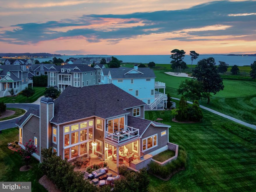 An Elevated Coastal Sanctuary in The Peninsula
Welcome to 33530 Tiderunner Avenue, a Furnished Echelon-built masterpiece in the prestigious Sanctuary Enclave of The Peninsula on the Indian River Bay. This custom luxury home blends coastal sophistication, smart innovation, and sweeping waterfront panoramas, creating an ideal haven for the discerning buyer who values both beauty and function. Perched on a premium lot overlooking the 7th tee, it offers unobstructed views of the Indian River Bay and lush fairways, all within one of Delaware’s most amenity-rich gated resort communities.
A grand entry welcomes you into a home where refined elegance is evident in every detail. High baseboards, wide casings, and 8-foot solid-core doors add substance, while professional-tinted Anderson windows protect interiors and frame breathtaking views. The soaring two-story great room is anchored by a gas fireplace with raised hearth, complemented by exquisite millwork, custom built-ins, and curated lighting. This gathering space flows into the gourmet kitchen and dining area, a showcase for both entertaining and daily living. Granite and rare quartz surfaces stretch across generous workspaces and the grand center island, which features abundant storage, a beverage and wine fridge, and deep undermount sink. A mosaic glass tile backsplash enhances the GE Monogram six-burner gas range with custom vent hood, and a suite of professional stainless appliances completes the space. A walk-in pantry and dedicated wine tasting room with wine storage tower add to the appeal. The main-level primary suite is a private retreat with tray ceiling, sitting area, and panoramic views. The spa-like ensuite offers large-format tile flooring, a frameless glass walk-in shower, dual vanities, private water closet, and two customized walk-in closets. Also on the first floor is a second bedroom with private ensuite, a home office with built-ins, a stylish powder bath, a spacious laundry room, and interior access to the oversized side-load three-car garage. A beautifully crafted staircase of fine mill and iron work leads to the upper level, where a bright loft opens to a private balcony with custom glass panels that preserve the view. Two additional bedrooms, each with refined finishes, share a well-appointed bath. A recreation room with wet bar, beverage fridge, kegerator, and built-ins offers abundant space for games, lounging, and entertaining. The exterior is equally impressive, with fiber cement siding, 2x6 construction, a custom paver courtyard, enclosed pet area with gate, planters, and professional mechanical screens on the porch. Mechanical blinds and shades provide effortless light control. Throughout the home, every inch of space has been maximized for function without sacrificing style. Being sold furnished with some exclusions.
As a resident of The Peninsula, you will enjoy world-class amenities including a private Jack Nicklaus Signature golf course, indoor and outdoor pools (with a wave pool and adults-only oasis), full-service spa, state-of-the-art fitness center, tennis, basketball, mini golf, and a private bay beach with kayak and paddleboard rentals. Nature lovers will appreciate the walking trails, fishing pier, and Audubon-certified nature preserve.
A breathtaking home in an extraordinary community, this is coastal resort living redefined.
Seller is a Full Reserve Golf Member which can be transferred to the buyer of this home bypassing the long wait list.