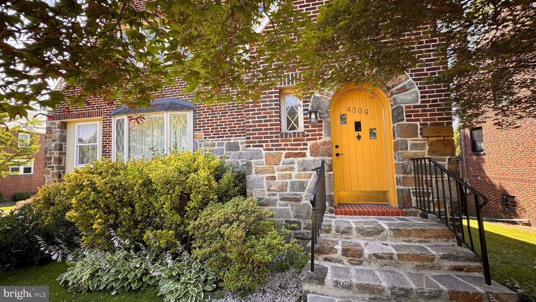 Discover timeless character and modern comfort in this beautifully updated 4-bedroom, 3.5-bath, four-story brick home, ideally situated on a spacious corner lot in the coveted Beverly Hills neighborhood in Baltimore City. Originally built in 1935, this stately residence showcases inlaid original hardwood floors, rich architectural details and thoughtful upgrades throughout. Step inside to an inviting first floor featuring a spacious living room, library, formal dining room, a powder room, and a new kitchen with sleek quartz countertops, California slate floors, exposed brick, modern cabinetry, premium appliances, and classic finishes—perfect for both everyday living and entertaining. The second floor offers three bedrooms including the primary bedroom with en-suite, and two additional bedrooms share a full bath. The third level offers a fourth bedroom with a bonus space, perfect for play/game-room. In the basement, step into a beautifully designed and expansive fully finished space that blends industrial chic with spa-like luxury. This versatile space features gorgeous exposed brick walls, polished concrete floors and ample room for recreation, entertaining, or relaxing. A true highlight is the custom Finnish sauna, perfect for unwinding after a long day, which is thoughtfully paired with a modern full bathroom. Step out from the kitchen onto a spacious concrete patio, ideal for dining or morning coffee. Just below, a charming stone patio provides additional space for entertaining, leading seamlessly to a large, recently constructed deck- perfect for summer gatherings. The yard is framed by mature river birch and fruit trees, adding both privacy and seasonal color. A brand-new shed offers storage for your tools and garden gear. Recent updates include a new roof, two new HVAC systems, new water heater, basement waterproofing, new windows, all updated electric and plumbing —offering energy efficiency and lasting value. Don’t miss this rare opportunity to own a historic gem with all the modern amenities. Schedule your private showing today!