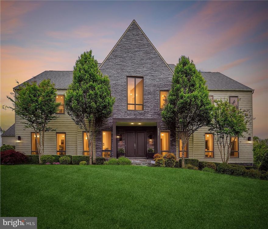 A Piet Boon Masterpiece in the Heart of Willowsford <br> <br>

Tucked within the rolling landscape of The Grant at Willowsford, this bespoke Line K Zuiderwind residence is a rare architectural gem—an inspired collaboration between world-renowned Dutch designer Piet Boon and discerning homeowners who reimagined its possibilities. The result: a singularly stunning, 9,100+ square-foot estate where refined design and uncompromising functionality exist in perfect harmony. <br> <br>

From the moment you enter, it’s clear this is no ordinary home. Every inch has been carefully curated to reflect a Scandinavian-modern ethos, elevated by unexpected luxuries and custom enhancements. The open-plan interior is anchored by wide-plank luxury vinyl floors that span all three levels, offering both warmth and resilience. Sculptural 12-inch baseboards and deep crown moldings bring elegant weight to soaring ceilings and grand 10-foot doors. <br> <br>

The architectural dialogue continues in the heart of the home—a chef’s kitchen outfitted with Viking appliances and centered around a dramatic quartz waterfall island, poised for both gourmet endeavors and intimate gatherings. <br> <br>

﻿Unique among Line K builds, this residence features a rare second Primary Suite on the main level—one of six en-suite bedrooms across the home—designed for flexible living or sophisticated guest accommodation. The primary bath is a spa-like retreat, showcasing luxe finishes and thoughtful details at every turn. A sleek, linear gas fireplace and custom closets further exemplify the high design language echoed throughout. <br> <br>

This residence doesn’t simply accommodate; it anticipates. From a full-size refrigerator and foot shower in the main-level prep kitchen/laundry to an additional upper-level laundry room and an entertainer’s bar with a second quartz island below, no amenity has been overlooked. Every floor opens onto its own private, covered porch, framing views of the surrounding woods and protected conservancy land—nature becomes not just a backdrop, but a central character in the home’s narrative. <br> <br>

Step outside into your personal resort: a 50-by-20-foot pool with swim jets, a tanning ledge, and a retractable cover sits alongside a separate, in-ground spa with champagne spill ledge, designed for year-round enjoyment. The travertine patio, complete with built-in firepit, invites evenings of quiet luxury or vibrant entertaining. And for those with a passion for homegrown living, a custom English garden with waist-high steel planters offers the perfect stage for cultivating herbs, flowers, and vegetables. <br> <br>

﻿Sited on nearly an acre of land and offering garage parking for five vehicles—including provisions for electric charging—this home is as efficient as it is elegant. A full suite of 2025-installed systems includes high-efficiency HVAC, water heaters, programmable thermostats, and a whole-house generator, ensuring modern convenience matches timeless design. <br> <br>