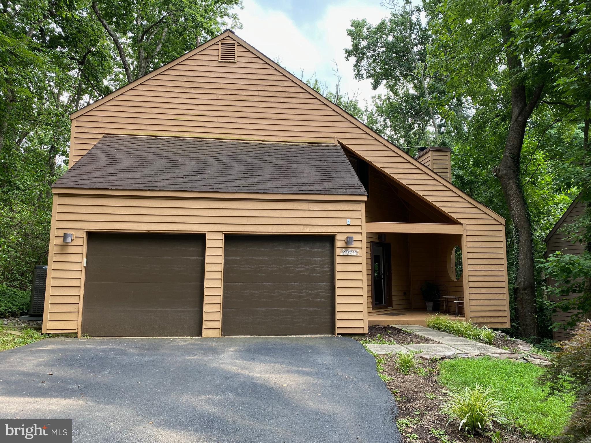 This cozy cedar sided contemporary with soaring cathedral ceilings, hardwood floors and an abundance of natural light has so much to offer. Located in one of Reston's most sought out neighborhoods in North Point Village, you can walk to most anything; shopping, Lake Anne's farmers market, pools, tennis and so much more. The large glass-enclosed sunroom with fabulous views of woods, wildlife and parkland is a fantastic addition to this home. With the press of a button, the radiant heated floor makes this an inviting room on those chilly fall evenings. The upper bedroom level has 2 bedrooms, each with their own bathrooms. The loft can be used for so many purposes. The primary bedroom has a huge walk in closet and a deep soaking tub. The living, dining and kitchen areas are open and flow easily for family and friend gatherings. The living room has built in cabinets and a gas fireplace. An incredible home in the heart of Reston. Come see for yourself!