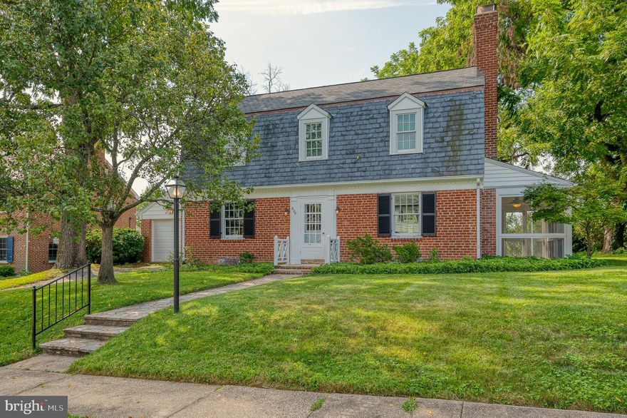 Classic Dutch Colonial located in the heart of the popular Towson neighborhood of Wiltondale.  Lovingly maintained and updated through the years. Windows replaced with highend Pella windows, with the exception of a few feature windows that add character and charm to this lovely home. The original hardwood floors are in very good condition, most of them have been covered with wall to wall carpeting for years.  All carpeting has been removed from the home. Main roof was replaced (top) 2021, breezeway and garage roofs were also replaced in 2021. The slate roof portion has been maintained.  Kitchen renovation in 2014 with classic white cabinetry,  granite countertops and SS appliances. The living room features a woodburing fireplace flanked by original decorative windows. The huge bow window in the dining room allows for lots of natural light, with a view also has a beautiful original corner cabinet.  Enjoy these late summer evenings on the screened in side porch featuring stone floors and ceiling fan.  The main level of this home also features a first floor den and powder room. In addition to the 4 bedrooms on the upper level, this home offers a finished basement with a rec room/family room for that added living space.  The one car garage is attached to the home with a covered breezeway, so no worries of getting caught in the rain!  A full list of maintenance/updates available upon request.  
You will love the beautiful backyard with a stone patio.