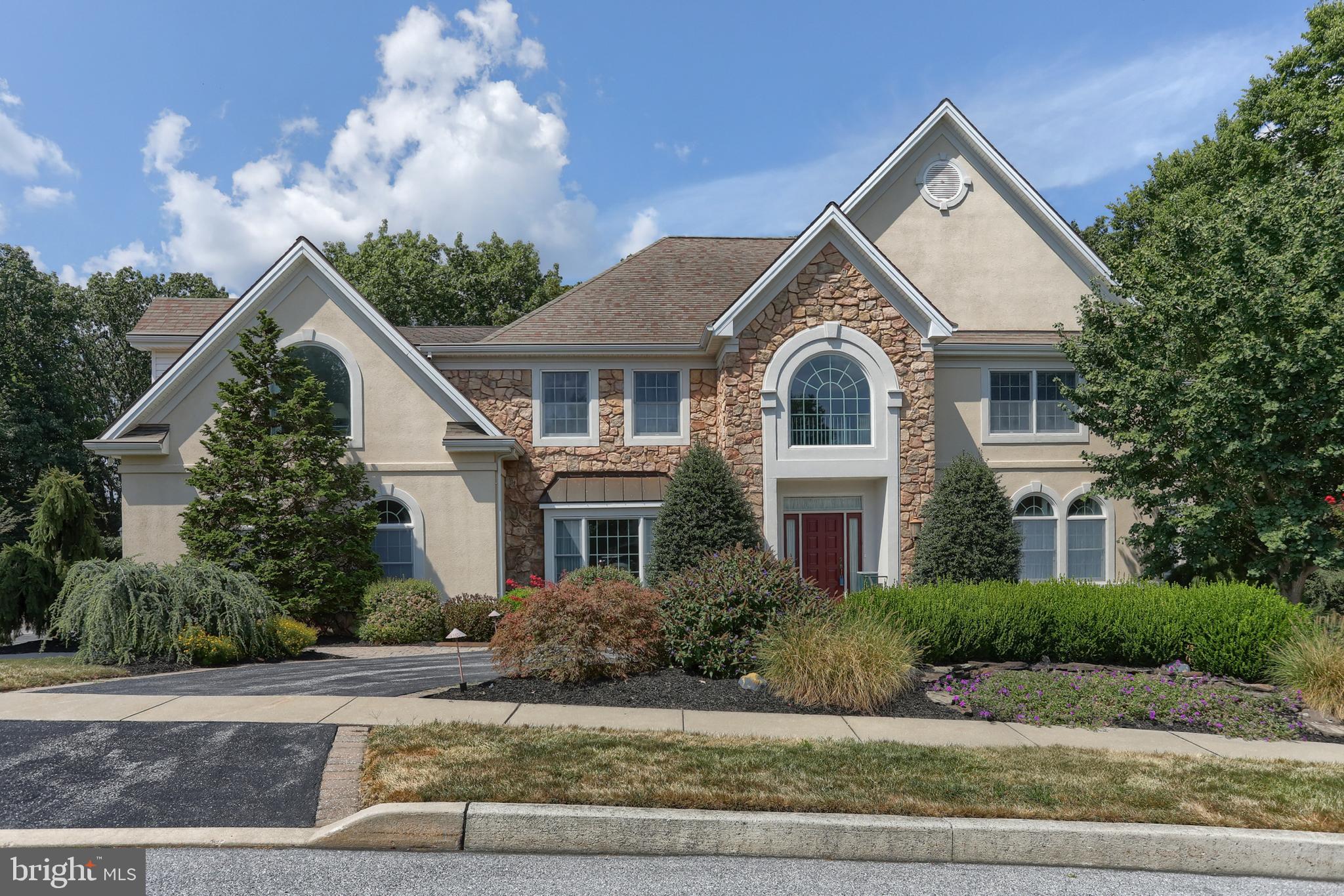 Welcome to 1002 Peggy Drive, located in the desirable Derry Woods Development of Hummelstown! Nestled on over an acre of wooded beauty, this stunning six-bedroom, three full bath, and two half bath home offers a rare blend of privacy, elegance, and nature. Surrounded by mature trees where deer are known to bed down, you’ll enjoy serene views and peaceful living just minutes from town, Hershey Schools, Hershey area attractions, Hershey Medical Center, and major highways. Step inside to find a bright and inviting floor plan featuring hardwood floors and ceramic tile throughout the first floor. The heart of the home is its spectacular two-story solarium, wrapped in windows that flood the space with natural light and provide year-round views of the wooded backdrop. The chef’s kitchen is a true standout, complete with two ovens, a gas range, and dual pantries—perfect for both everyday cooking and entertaining. A mudroom adds convenience, while a three-car side-entry garage provides plenty of parking and storage space. Upstairs, you’ll find five spacious bedrooms, including a relaxing primary suite, and three full baths. The finished walkout basement adds even more living and entertaining space, featuring a bar, a sixth bedroom, and a half bath—ideal for guests, in-laws, or a private home office. Outside, enjoy a composite deck, gorgeous hardscaping, and peaceful wooded views that make every morning feel like a retreat. This tucked-away home in a neighborhood of trees is a rare find—luxurious living with a touch of nature’s tranquility!