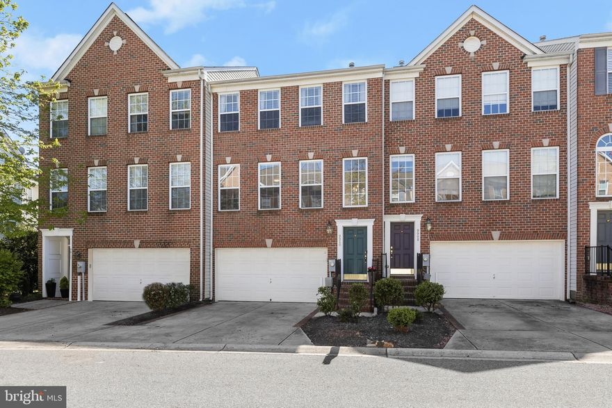 Welcome to this stunning townhome nestled in Laurel's amenity-rich Emerson Community, tastefully updated with custom finishes throughout. From the moment you enter the two-story foyer, you'll be greeted by design inspired details beginning with a built-in shoe storage cabinet and iron and wood handrails leading to the spacious living room, perfect for relaxation and entertainment. The sun-filled open floor plan features a chef's kitchen, dining room, and sitting room with a gas fireplace, highlighted by a rustic wood mantle. The chef's kitchen boasts quartz countertops, tile backsplash, renovated cabinets, a deep pantry with shelving, and a reshaped entertainer's island breakfast bar. The dining room showcases a beautiful accent wall and offers sliding door access to the deck, ideal for outdoor dining and enjoyment. Retreat to the primary bedroom suite under a high vaulted ceiling, complete with a sitting room featuring a corner gas fireplace and a walk-in closet. The luxury primary bath features a dual vanity, a glass enclosed shower, and a jetted tub, providing a serene escape.  High vaulted ceilings adorn the two additional bedrooms, and one has been detailed with an accent wall, and offers a walk-in closet. The lower level offers additional living space with a full bath, a large storage closet with shelving, and a recreation room with access to the patio, perfect for indoor-outdoor living.  Additional storage in the garage.  Enjoy Emerson’s many amenities that include a clubhouse, swimming pool, tennis courts, and tot lots. Don't miss out on this exceptional opportunity!