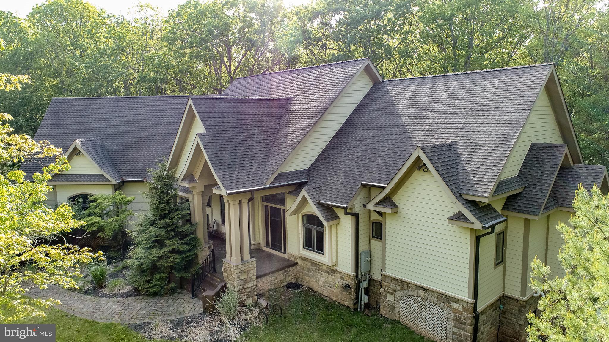 Beautiful One-of-a-Kind Luxury Home! Features 8 Bedrooms, 7.5 Baths with Heated Indoor Pool, Lake Access, and Deeded Boat Slip. This spacious, almost 10,000 sq ft home is full of amenities including granite countertops, tile showers, 2 interior gas fireplaces, hardwood floors, pool table, 9-person theater room, built-in brick pizza ovens, two hot tubs, 2 exterior wood burning fireplaces, and much more. Enjoy quiet time or invite a guest for an extended stay in the In-Law Suite above the pool house. Home is being sold "turn-key", fully furnished. A quiet neighborhood and a magnificent home make this the perfect place to enjoy friends and family. Established rental home earning $188K of rental income in 2024, and almost $90k on the books for 2025. You don't want to miss out on this one! Call today for more info.