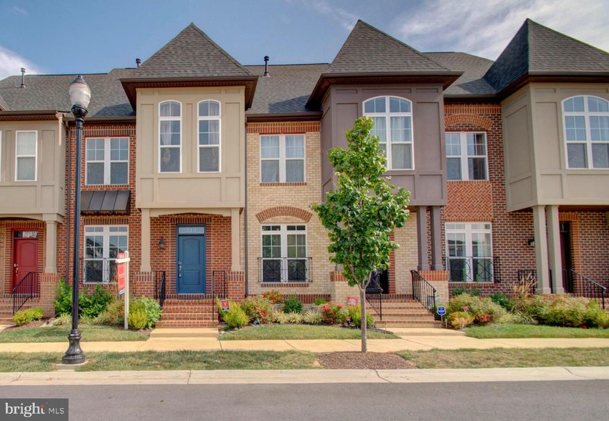 NOTE: THIS IS AN ASSUMABLE MORTGAGE WITH PENNYMAC. INTEREST RATE 2.625% If you're looking for beautiful, clean, contemporary lines, this TH is for you! 2,290 sq ft of an elegant exterior elevation offers a covered entryway and leads you into a home with too many upgrades to count. Beautiful, yet durable flooring throughout the home. Gourmet kitchen, boasts a large quartz island, gas burner cooktop and an additional wall oven/convection microwave. Plenty of room for snacks and quick meals. Drawers and cabinetry offer great storage. The dining room, kitchen and great room flow together to make this a wonderful place to entertain or gather around the gas fireplace for a quiet evening. 
Second level offers three bedrooms and two full baths. Ample closet space. Baths are tiled and have quartz countertops. Escape to the rooftop level to lounge in the indoor loft or the outdoor sky terrace  or
go to the fully finished lower area for a movie in the  media room. Additionally you'll find a large rec room on this lower level. Let your imagination design this room for your desires.
Live within close proximity to downtown Frederick and take advantage of the many art venues, restaurants and stores for shopping. Or cool off in the community pool. Whatever you do, come see this TH. You're sure to fall in love. AGENTS: PLEASE TURN OFF LIGHTS, AND LEAVE THE HVAC SYSTEM AT THE TEMPERATURE AT WHICH  YOU FOUND IT SET. THANK YOU.