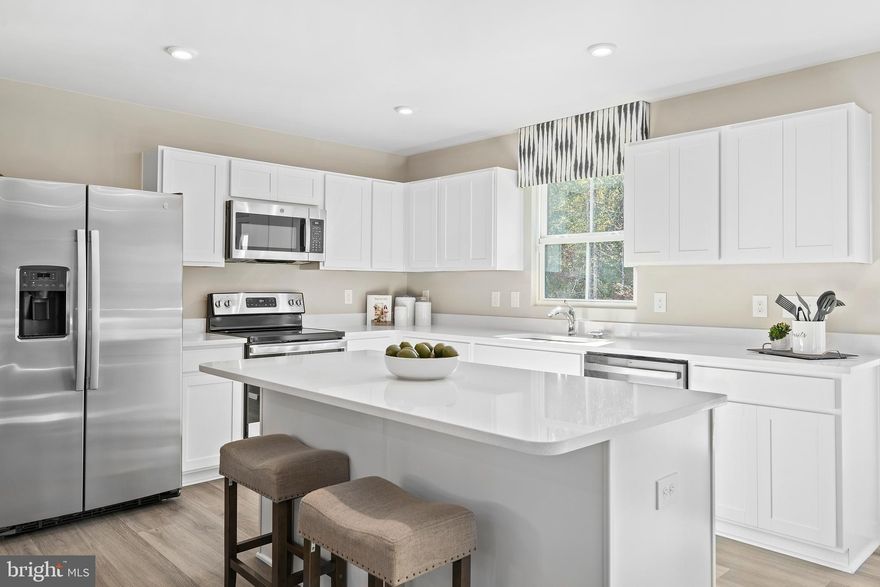 To‑be‑built Cedar plan at the Oak Leaf Meadows community!  This beautifully designed 4‑bedroom, 2.5‑bath home perfectly blends everyday functionality with modern features. Step into the welcoming foyer and continue into the spacious great room, which flows seamlessly into the gourmet kitchen featuring a large center island, brand‑new appliances, and an adjoining dining area—ideal for entertaining and daily living.
Just beyond the main living space, a hallway leads to a convenient powder room and a versatile flex space that can easily be used as a home office, hobby room, or play area. Upstairs, three of the four bedrooms feature walk‑in closets, along with a full hall bath and an upstairs laundry room for added convenience. The luxurious owner’s suite offers generous living space, a huge walk‑in closet, and a dual‑vanity bath. An optional basement is available, depending on homesite, providing additional storage or future living space.
Oak Leaf Meadows offers an exceptional location in the Musselman School District—just 5 minutes to I‑81, 15 minutes to Martinsburg, and 20 minutes to Winchester. Closing assistance available with the use of the seller’s preferred lender. Lot premiums may apply. Other floorplans and homesites are available. Photos are representative.
Visit the model home at 186 Inola Court, Inwood, WV 25428, and learn why The Cedar is a must‑see!