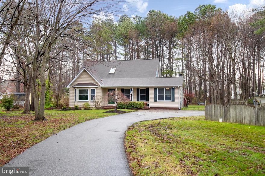 Welcome Home!  This beautiful Cape Cod is looking for it's new owner, and it won't last long!  Boasting a first floor primary suite, home office (potential 4th bedroom), ENORMOUS living room, spacious kitchen and comfy sunroom, this house has it all... and that's only on the first floor!  The sun room has ample storage, laundry, and a pellet stove to keep you cozy in the colder months while you enjoy the walls of windows to overlook the 1.22 acres!  Off the sunroom is an expansive deck that wraps around the entire back of the house.  Upstairs you'll find two ample sized bedrooms with brand new plush carpet, and a freshly updated bathroom.  At the end of the driveway is short walk to the water and a boat ramp for your enjoyment.   Upgrades include new heat pump on first floor, fresh paint throughout, brand new carpet, updated bathrooms.  Schedule your showing today!