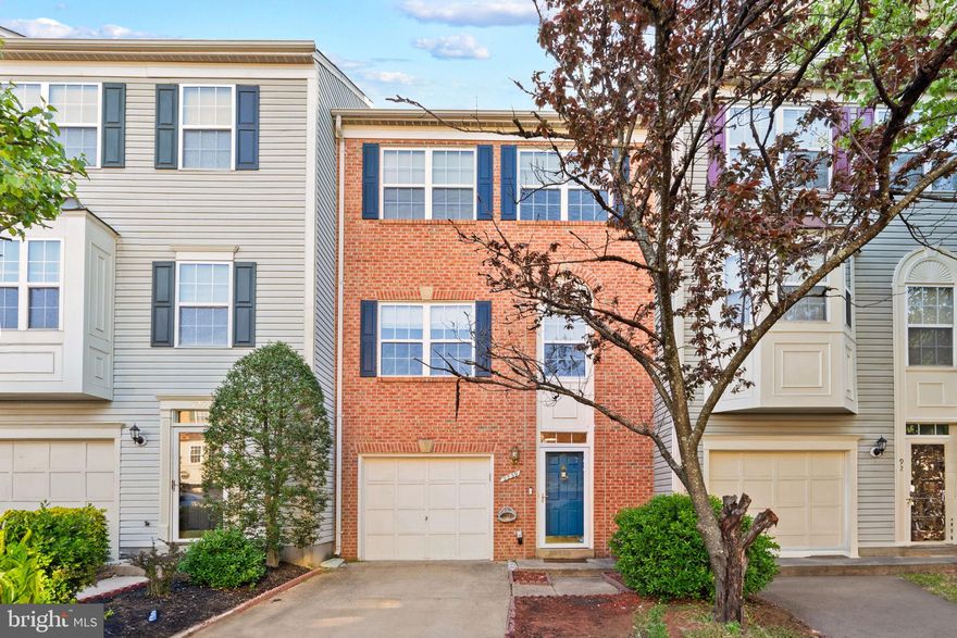 Welcome home to Gunston Corner! This three-level townhome offers comfortable, spacious living in a convenient location, with abundant natural light and thoughtful updates throughout. On the main level, hardwood floors flow seamlessly throughout an open floorplan that connects the eat-in kitchen to the spacious living and dining areas. The renovated kitchen (2022) includes plenty of cabinet storage, granite countertops, a custom tile backsplash, and stainless steel appliances (including a flex duo oven). Pull up a stool to the island bar or enjoy a casual meal in the bright breakfast nook. Wide windows fill the home with natural light, creating a bright and inviting setting that is perfect for everyday living or entertaining. Upstairs, the primary bedroom features brand new plush carpet, a dramatic vaulted ceiling, large walk-in closet, and a stylishly updated en suite bathroom. Both additional bedrooms include soft new carpet and wide closets, with shared access to the second full bathroom in the hall. The lower level adds an additional flexible living space with a cozy recreation room complete with a corner gas fireplace.  From here, walk out to a private fenced backyard for relaxing, gardening, or playing, or step onto the wooden deck off the kitchen for outdoor dining. On the front of the home, the one-car garage and driveway provide convenient parking and extra storage. Major home updates include a new roof (2018), water heater (2020), and HVAC (2020), new carpet (2025). Gunston Corner amenities include an outdoor pool, playground, and green space. Minutes to Lidl, Amazon Fresh, Lorton Station Town Center, Springfield Town Center, Kingstowne, Laurel Hill Community Center, Occoquan Regional Park and Historic Occoquan, Workhouse Arts Center, Davison Army Airfield, and Fort Belvoir. Quick access to I-95, Ox Road, Route 1, and the Fairfax County Parkway - plus the VRE is less than 2 miles away for easy commuting. Schedule a private tour of your beautiful new home today!