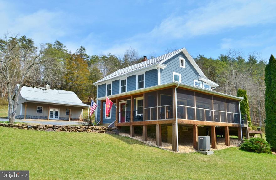 Exquisite Early 1900's Craftsman-style Farmhouse Showcases a Magazine Worthy Restoration! Fall in Love with the Convenient Location & Privacy. Listen to the Stream & Relax on the 2-Tiered Deck & Screened Porch w/ Dining Area Looking over your 12+ Acres & Stream Front! Gourmet Kitchen, Gas Fireplace w/ Stone Surround, Wood Stove, Hardwood Floors, Tile Bathrooms! Ask Agent for List of all Amenities!