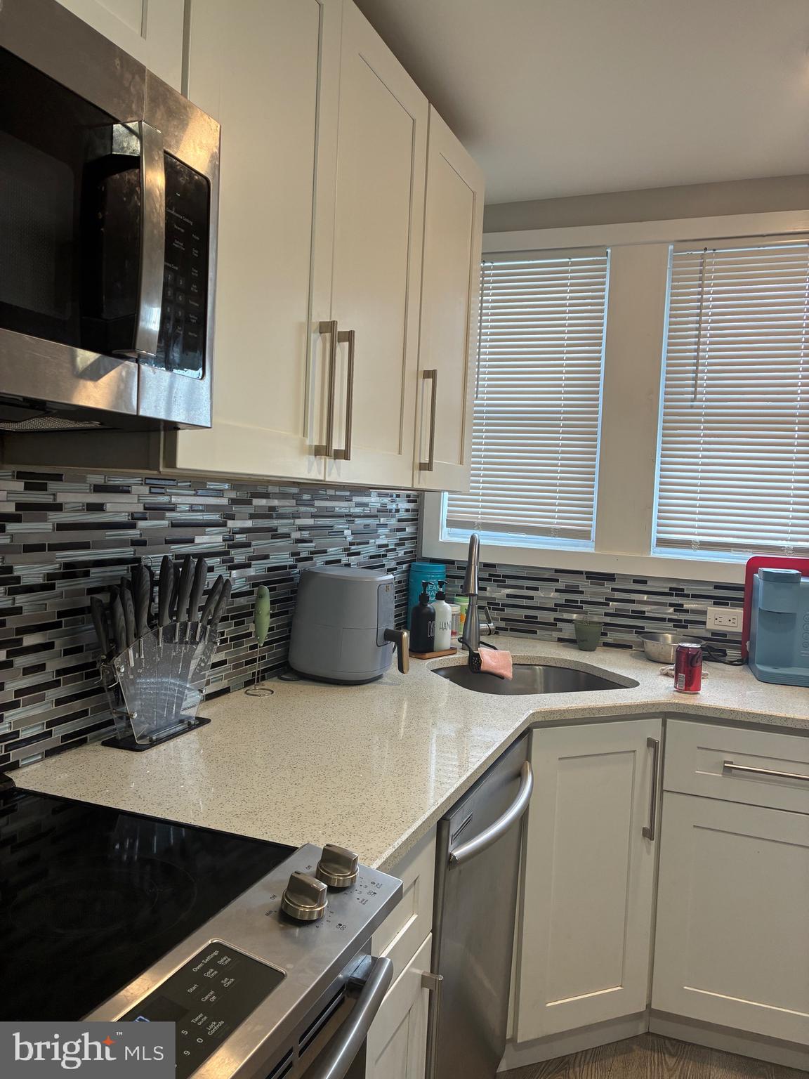 This 3-bedroom, 1-bath townhome in Harrowgate offers a comfortable layout with great features throughout. The main level includes a spacious living room, dining area, and a modern kitchen with white cabinetry, a tile backsplash, and stainless steel appliances. Enjoy wood flooring, recessed lighting, and central air for added comfort. Upstairs, you'll find three bedrooms and a full bathroom with a glass-enclosed shower. The basement provides additional space for storage. Conveniently located near public transportation and local amenities, this home is move-in ready and a great option for a homeowner or investor. The Harrowgate neighborhood offers easy access to nearby restaurants, shopping centers, and everyday conveniences, making it a practical and well-connected place to call home.