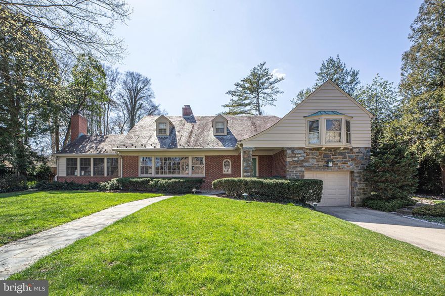 Classic mixed material Spring Valley cross gable on highly desirable Overlook Road. This home has been immaculately maintained and rests on a uniform and level 0.3 acre lot on one of the neighborhoods most coveted streets. The main level of this home flows beautifully from the entry foyer, to a front formal sitting room with fireplace, kitchen, connected side study, formal dining room, expanded family room with a second fireplace and an massive attached covered porch with level access to the rear lawn. Upstairs are four good sized and well-appointed bedrooms. A charming home ready for its next owner with tremendous appeal and potential.