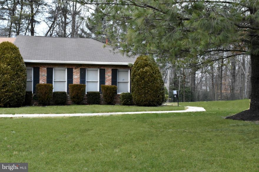 Spacious end unit townhouse on nice lot. Backs to trees and park with tennis court. Lots of natural light. 2 large bedrooms & 2 baths on main level. Shows like a detached home with private entrance. Natural gas heat. The unfinished basement is ready for your plans. Awesome opportunity to purchase and renovate as desired. contract quote for  complete remodel @   $21,000.  Convenient to I-95.