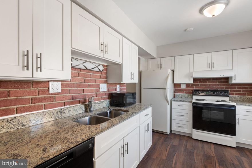 This charming Colonial townhouse in the desirable Staffordborough subdivision offers a fantastic investment opportunity. With 1,320 sq. ft. of finished space, this home features a thoughtfully designed combination kitchen and living area, perfect for modern living. The kitchen is equipped with essential appliances, including a dishwasher, electric oven/range, and refrigerator, ensuring convenience for future tenants or homeowners. The property boasts three spacious bedrooms and a versatile basement with daylight and rear entrance, providing potential for additional living space or rental income. Built in 1971 with durable brick construction, this home combines classic charm with lasting quality. Investors will appreciate the low maintenance and potential for appreciation in this sought-after area. With no pool or extensive exterior upkeep, this property is ideal for those looking to maximize returns. Don't miss the chance to add this inviting townhouse to your portfolio!