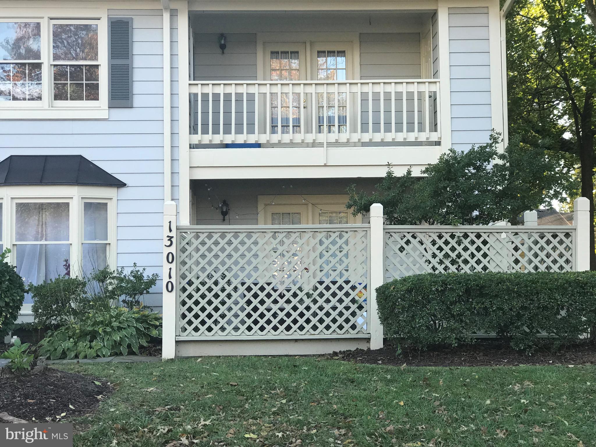 Lots of light. Ground level condo with private fenced-in patio. Ceramic and carpeted floors, granite counter in kitchen. Stacked washer and dryer. Large walk-in closet. Fully Available.