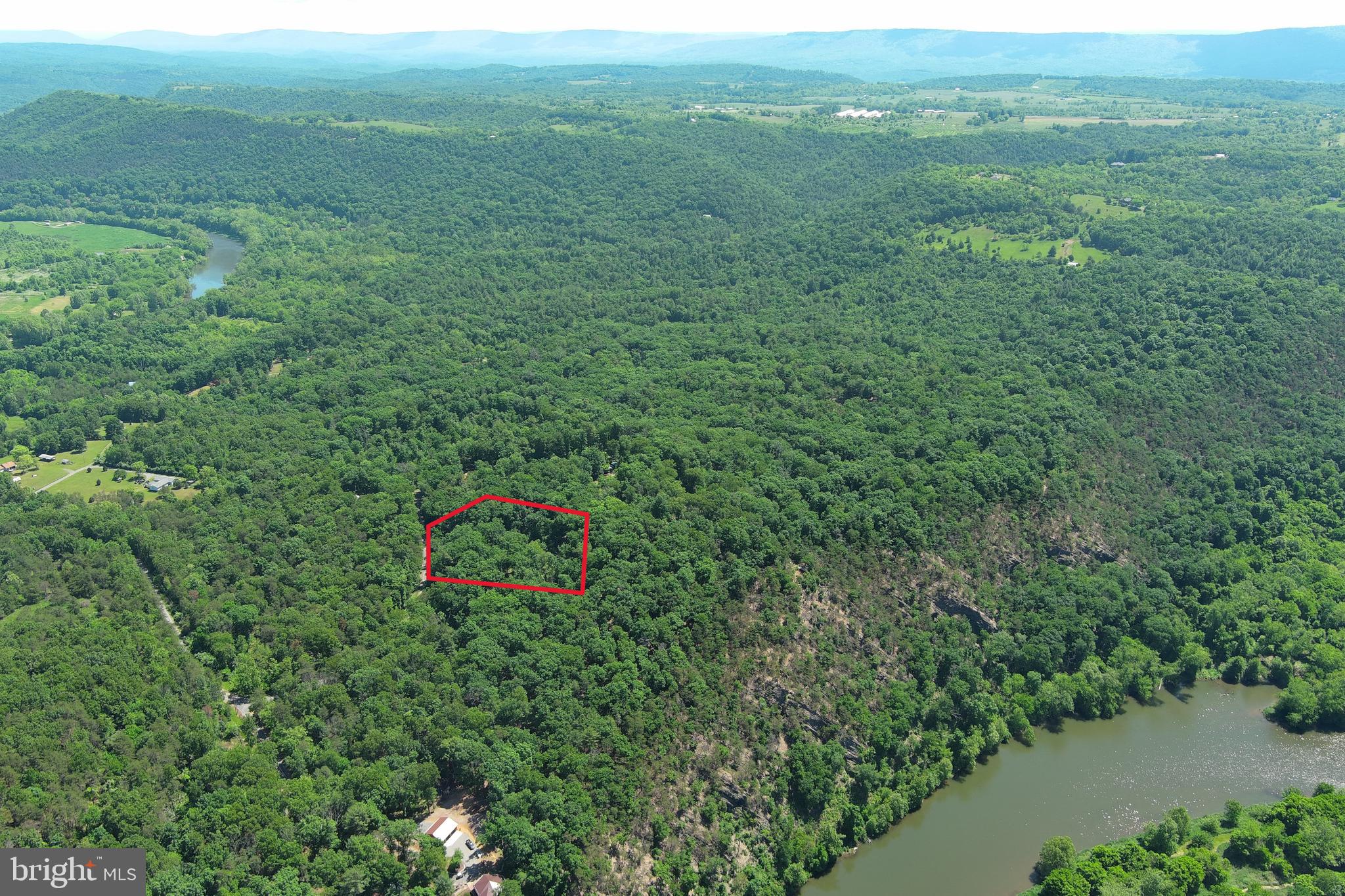 THE BEST THINGS COME IN SMALL PACKAGES.....2 PRIVATE WOODED ACRES WITH DRIVEWAY INSTALLED TO BUILD/CAMP SITE WITH BIG BOY SIZED MOUNTAIN VIEWS AND 2 BEDROOM SEPTIC SYSTEM INSTALLED! 20K WORTH OF INFRASTRUCTURE ALREADY IN PLACE. PULL IN YOUR CAMPER ON DAY 1.....SHORT PULL FOR ELECTRIC.....FOR ANOTHER 12K YOU COULD HAVE THE WELL & ELECTRIC IN PLACE AND HAVE A FULLY FUNCTIONAL CAMP/BUILD SITE. OH YEAH, THE COMMUNITY HAS AN AWESOME COMMON AREA ON THE SOUTH BRANCH OF THE POTOMAC RIVER FOR UNLIMITED CANOE, KAYAK, FISHING, SWIMMING OR JUST CHILLING IN THE RIVER WITH THE BEVERAGE OF YOUR CHOICE! TIRED OF PAYING OUTRAGEOUS CAMPGROUND FEES? LOOKING FOR A NICE LOT TO BUILD YOUR WEEKEND GETAWAY ON? LOOKING FOR A PLACE TO GET THE H....AWAY FROM PEOPLE? THE SEARCH IS OVER SON.....MAKE THE CALL, MAKE THE DRIVE, WRITE THE CHECK AND LETS GET THIS DEAL DONE!