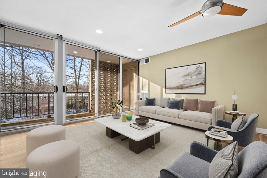 Spacious and rarely available top-level end-unit condo featuring 3 bedrooms and 2 full bathrooms with 1,132 square feet of living space. This beautifully updated home includes two assigned parking spaces, a private storage unit, and most utilities included, all within a secure elevator building ideally located in the heart of Annandale.

Inside, the open living and dining area showcases engineered hardwood floors, a ceiling fan, and a striking brick accent wall. The updated galley kitchen offers granite countertops, maple cabinetry, a tile backsplash, and gas cooking. Sliding glass doors off the living area open to an expansive 21-foot-wide private balcony with peaceful tree views and added privacy.

The hallway leads to a renovated full bath with a tub and shower combination. The primary bedroom features parquet flooring, a walk-in closet with an Elfa shelving system, and an updated en-suite bath with a tiled shower. Two additional generously sized bedrooms also feature parquet floors and large closets with Elfa systems.

Laundry facilities are conveniently located just down the hall on the same level. Utilities are included except for electric, cable, and internet. Community amenities include a swimming pool, and the location offers easy access to commuter bus routes, Routes 236 and 495, nearby parks, schools, and a shopping center with grocery stores, dining, coffee shops, and retail.

Quiet, convenient, and centrally located in Northern Virginia—this is an opportunity you won’t want to miss.