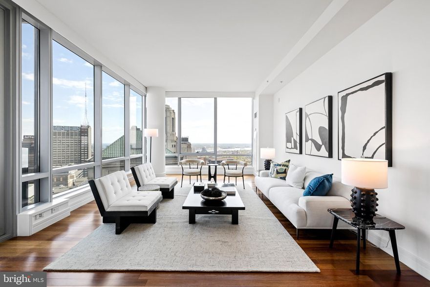 Step into an elevated urban haven, where refinement meets convenience in this prestigious high-rise residence. Offering three bedrooms and three and a half baths across over 2000 square feet of pristine living space, this unit stands alone with its exclusive balcony (only available to B units), commanding breathtaking views of the Iconic City Hall and the city skyline. Floor-to-ceiling windows flood every room with natural light, unveiling panoramic vistas from the Delaware River to the western sunset that redefine city living. Indulge in the pinnacle of modern luxury, with a 10,000+ square foot amenities floor including health club, pool, hot tub, and expansive lounge featuring a plush theater screening room and catering kitchen,.
Recent upgrades to this 5 Star building include an outdoor dog park, and newly renovated terrace which will include multiple outdoor grills & dining areas and several outdoor lounge areas with fire-pits and much more. The chef's kitchen boasts Subzero refrigerator, Viking 5-burner gas cooktop, oven, warming drawer, Miele dishwasher, U-Line wine cooler, and more. Valet parking and a dedicated parking space ensure effortless convenience, while Ritz membership privileges offer upgrades and discounts at not only the adjacent Ritz Carlton Hotel but worldwide. With its unrivaled location, impeccable finishes, and unparalleled amenities, this high-rise gem epitomizes urban living at its finest. Welcome to a space where luxury knows no bounds.