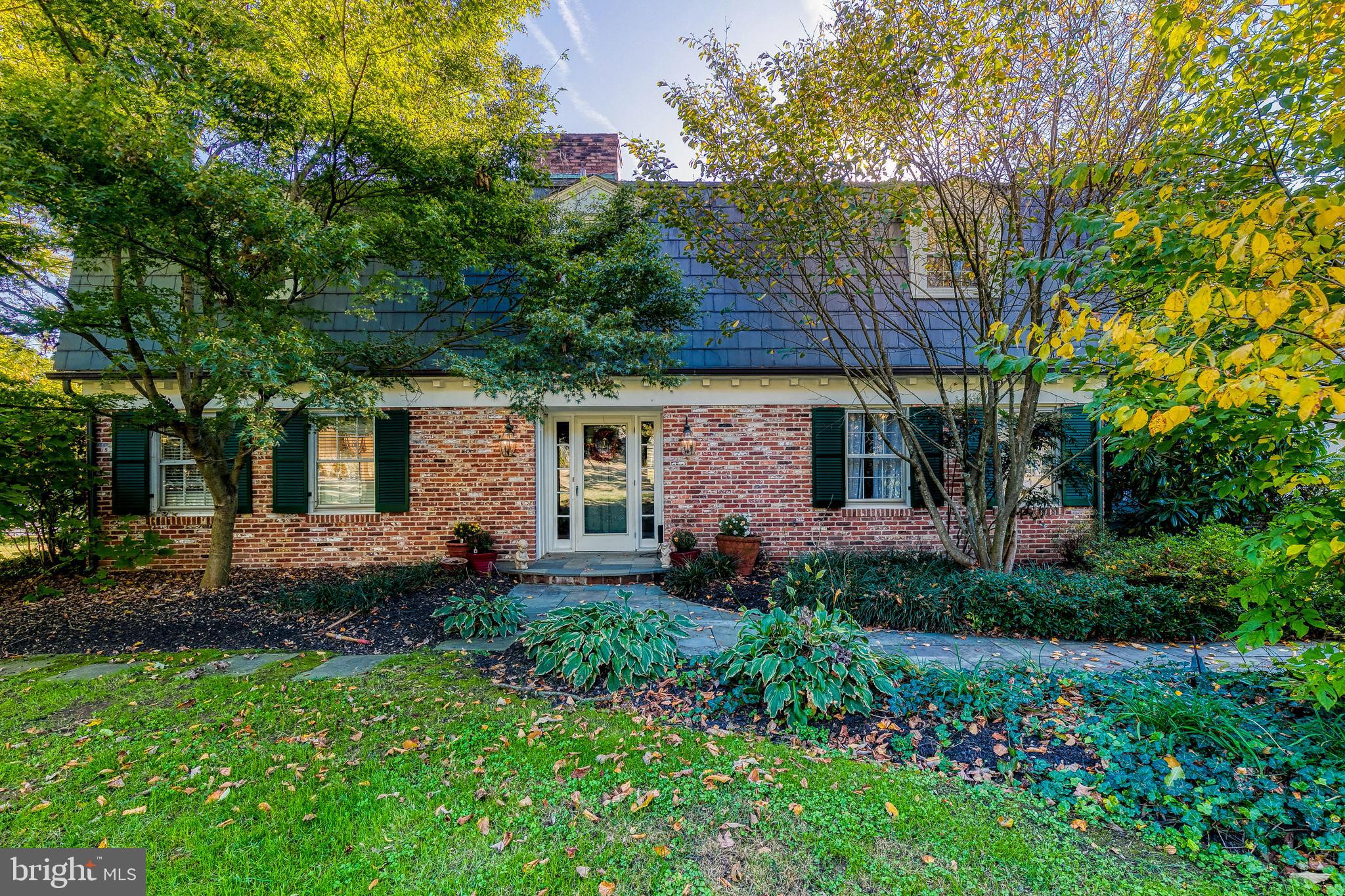 Coming soon in Monkton! This beautiful brick home is a complete retreat from the hustle and bustle of everyday life, tucked away on more than 5 acres of gorgeous green land in Monkton's quiet My Lady's Manor Historic District. You'll be in awe of the stunning curb appeal before you even step inside- exterior bricks from when Charles Center in Baltimore City was built and a beautiful bluestone walkway.
Once inside, you'll find a grand and spacious home full of natural light. Full of undeniable charm, this home includes a huge stone fire place, wainscoting around the living room fireplace from doors of the old St. James church, and many other details that bring this home to life. With 4 bedrooms, two full bathrooms, a powder room, and a basement in the main house, there's plenty of space to spare.
Plus, there's a studio apartment perfect as a guest/in-law suite with its own kitchen and full bathroom above the garage! Two flagstone patios and sprawling yard are perfect for getting fresh air and admiring the gorgeous landscape any time of year. Entertain friends and family outside when the whether warms up and don't forget the in-ground pool, the perfect centerpiece for your next summer soiree! This stunning property is truly one of a kind -- you don't want to miss it!