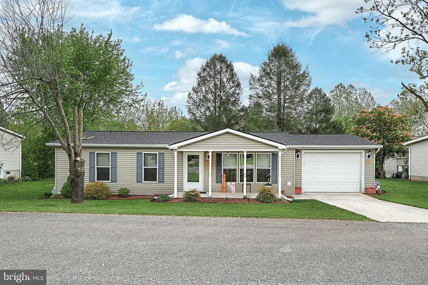 Welcome Home to this beautiful remodeled and well cared for manufactured home in Pine Run Retirement Community. With 2 bedrooms and 2 full baths, this is the perfect place for someone who desires or needs one floor living or possibly wanting to downsize. The current owners have put a lot of love and sweat equity in this home with numerous updates including a new roof, new furnace, new hot water heater, new dishwasher, new electrical and new plumbing, new flooring, added ceiling fans and easy entry doors in both bathrooms to access plumbing. Just off the dining area you will also find a large, tranquil screened in patio  with a line of trees out back for extra privacy.  The one car attached garage has some extra storage space and the adorable front porch is perfect to sit outside and say hi to neighbors as they walk by. These homes sell fast so don't miss your opportunity to schedule a showing!  This is a 55+ community, however only 80% needs to be occupied by those 55 and older. Please feel free to call the Listing agent with any questions.