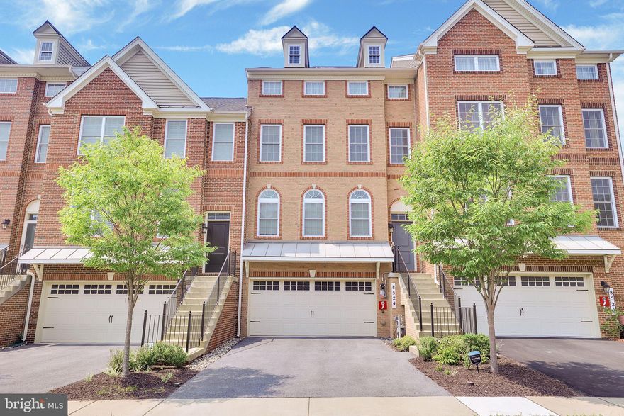 Welcome to this exquisite Toll Brothers luxury townhome in the highly sought-after Arundel Forest community. This stunning four-level residence is highlighted by a classic brick façade with charming bump-outs, a spacious driveway, and a two-car garage. A welcoming portico leads you into the home.

The gourmet kitchen is equipped with premium stainless steel appliances and seamlessly connects to the dining room, ideal for entertaining. The adjacent living room features a beautiful fireplace, adding to the home's inviting atmosphere.

The open and airy interior boasts brand-new flooring, fresh carpet, and updated paint throughout. The main level also includes a convenient half bath.

On the upper level, you will find four well-appointed bedrooms, all filled with natural light. The Owner’s Suite features a double vanity and an upgraded shower with stylish new floors.

The fourth level offers a versatile loft with a rooftop deck and a bonus room, perfect for recreational activities. Enjoy upgraded bathrooms and the additional space provided by the loft and rooftop deck for relaxation and entertainment.

Conveniently located for easy commutes to major cities and close to key transportation routes, this home perfectly balances luxury and practicality. The community amenities include a pool, playgrounds, and plenty of natural beauty.

Don’t miss the opportunity to own this luxury townhome in a prime location. With its unparalleled features and desirable setting, this home is sure to sell quickly. Schedule your private showing today to experience the epitome of refined living.