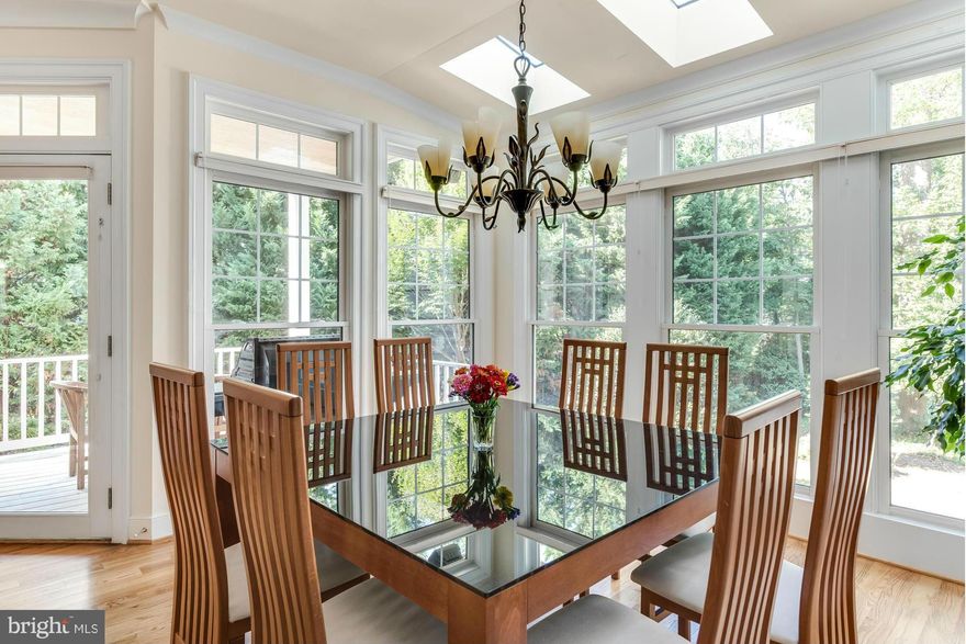 An ideal set-up w/ easily accessed deeded deep water slip, 2 car garage.Elevator top-to-bottom serves spacious Eastport townhouse w/ lg rooms & pvt setting. Garden outlook w/ est. trees & lovely winter water views. Light & bright main level opens to delightful porch off LR/DR. Full bath &main level office- possible bdrm. Only a  block to stores/services/deli."Scale down" but live elegantly!