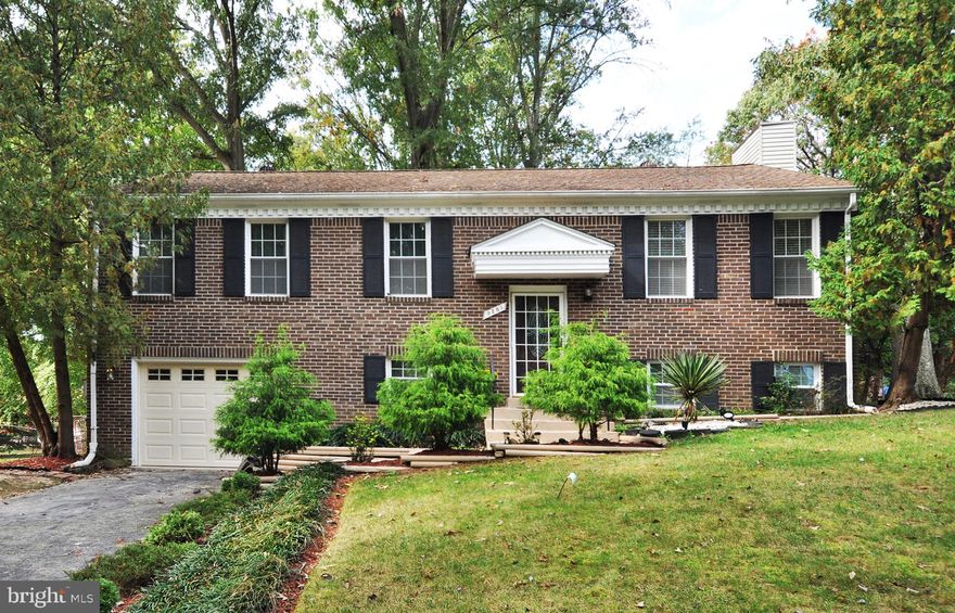 Back on market.  Buyer financing fell thru!  Pending Release. This impressive & immaculate split level home is well appointed on a premium lot which offers the privacy of natural preservation.  Designer touches & upgraded features enhanced throughout. Open and opulent floor plan filled with an abundance of natural light and graced by gleaming hardwood floors on the main level. Cool hues & modern light fixtures give the formal living room and dining room a contemporary flair. Indulge your culinary skills in this awesome gourmet kitchen complete w/island, stainless steel appliances, granite countertops, and designer cabinetry. Imagine morning coffee watching the sunrise OR evening sunsets relaxing on your beautiful DECK with a custom wood slated awning. The Fully Finished Basement boasts a chic decorative wall surrounded by lots of windows flowing with natural sunlight. A great space for indoor entertaining & social gatherings OR walk out to your private fenced backyard which is perfect for your summer BBQ's***All this and more!!!  All offers highest and best due Monday 12/27/21 at 10am