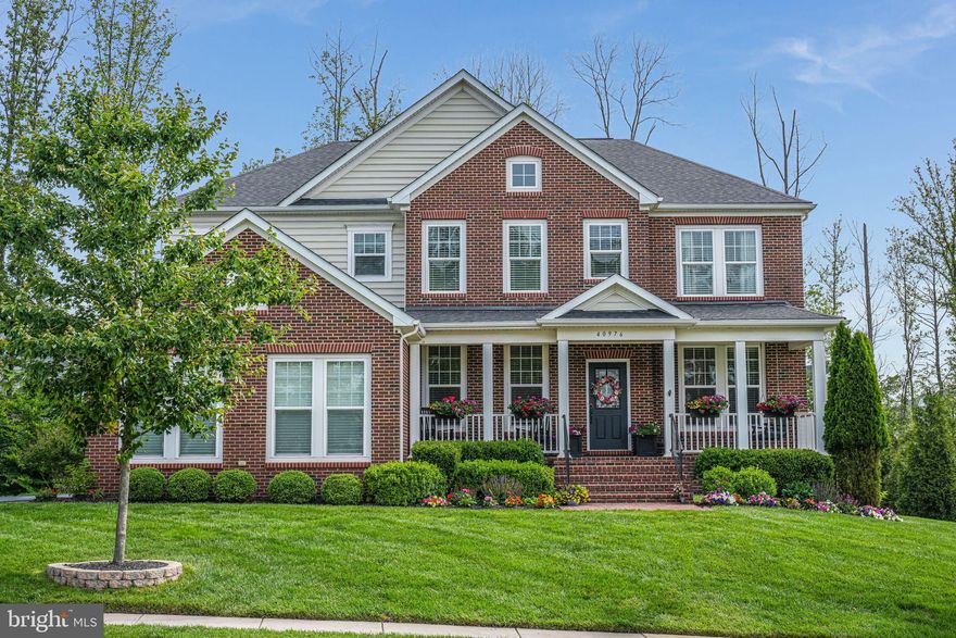 Welcome to your dream home!  Featuring over $300,000 in design studio upgrades, this stunning property offers a grand foyer that opens to formal living and dining rooms, with beautiful hand-scraped flooring flowing into a spectacular two-story family room featuring a floor-to-ceiling stone fireplace. The main level includes a bedroom suite with a full bath, providing a private retreat for guests, in-laws, or an au pair. 

The gourmet kitchen is a chef’s dream with quartz countertops, a high-end appliance package, a spacious center island with seating, a walk-in pantry, and a built-in butler’s pantry. It opens to a beautiful breakfast room perfect for casual dining.  Upstairs, the landing includes a sitting area and four bedrooms with three full bathrooms. The expansive primary suite boasts two walk-in closets and a spa-like bath with dual vanities, a soaking tub, and a walk-in shower. The secondary bedrooms offer plush new carpeting, walk-in closets, and access to two additional bathrooms.   The fully finished lower level, spanning over 2,000 sq ft, is an entertainer’s paradise! Enjoy multiple recreation spaces, such as a built-in wet bar with a beverage and wine fridge, a three-tap kegerator, a media room with projector and Dolby Atmos wiring, two additional bedrooms, a full bath, and a large exercise room/den.

The outdoor space is just as impressive, featuring a 1,200 sq ft flagstone patio with a full masonry fire pit, stone-veneered seating wall, stone walkway, 11-zone irrigation system, outdoor kitchen with built-in grill, and a Green Egg smoker.  The patio and deck stairs are equipped with automatic slimline lights. The yard is also beautifully landscaped with $10,000 in recent upgrades and offers a tree-lined rear and side yard for privacy. 

You do not want to miss out on this one!  Schedule your tour today and make this amazing property yours!