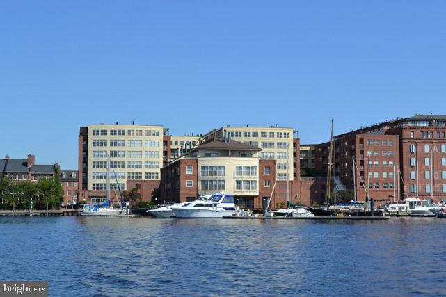 Rare opportunity to own a spacious 1 bedroom and den, 1 full and 1 half bath condo with great water views from balcony. This 1,178 sq. ft. unit in a Fells Point waterfront building is ASTONISHINGLY priced! The condo has hardwood flooring throughout and updated systems. The unit is sold a"as is". Great opportunity to make this Belt's Landing condominium with some TLC your new home. 2 car garage parking and a storage unit are included. Building amenities feature: 24 hr. front desk coverage, outdoor pool, security and a fantastic newly renovated gym. Belt's Landing is conveniently located close to bars, restaurants, shopping, Downtown, Inner Harbor, Johns Hopkins and other medical institutions, and major highways.