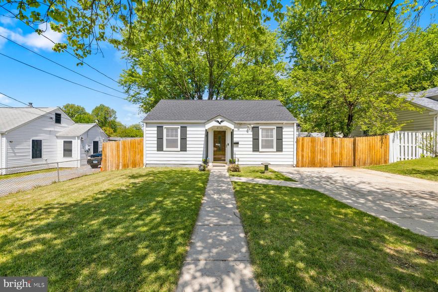 Charming and fully updated single-family home offering bright, open living spaces and stylish finishes throughout! The main level features a spacious living room with recessed lighting, beautiful flooring, and plenty of natural light, flowing into a well-appointed kitchen with stainless steel appliances and convenient access to a dedicated laundry area. The renovated bathroom showcases modern tilework and a sleek glass-enclosed shower, while the bedrooms provide comfortable, light-filled retreats. Step outside to enjoy a fully fenced backyard with a large patio—perfect for entertaining or relaxing.  The 20x10 shed had been converted into additional living space, perfect for a  as a home office, gym, studio, or hangout space. This space has a brand new mini split for both heating and air conditioning. and a front patio. Complete with a private driveway and great curb appeal, this move-in-ready home is a must-see!