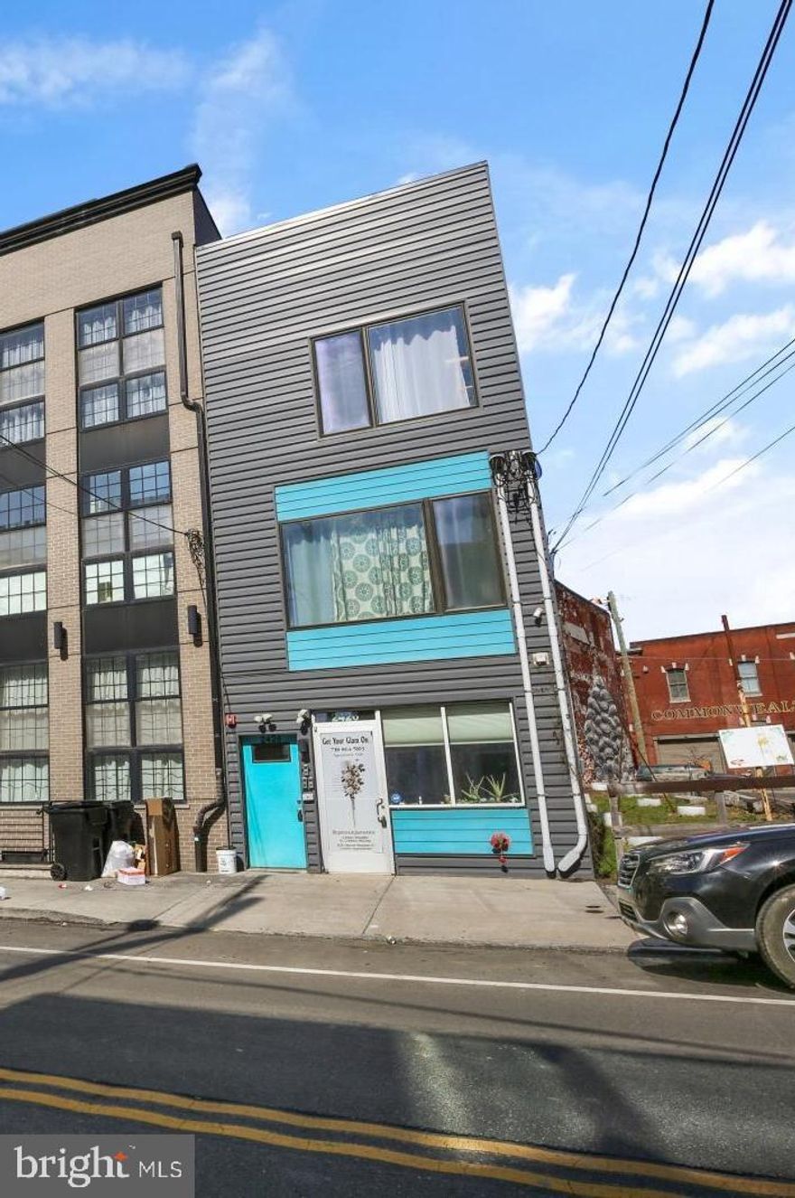 This stunning quadruplex is located in a prime location on Frankford Avenue. The building welcomes you with a cheerful, modern façade offering vibrant pops of color and is comprised of a first-floor commercial space and three residential units (one 2BR/1.5BA and two 1BR/1BA units). Each unit is outfitted with contemporary finishes, including hardwood and tile flooring, recessed lighting, stainless steel appliances, and more updated modern features throughout. Large windows adorn all of the units, providing tons of natural light. The bi-level 2BR unit includes a large private back patio. Fully occupied, this building is suited for a savvy investor or someone looking to occupy one unit and use the rental income to cover their mortgage! With convenient access to public transportation and major highways, it's a commuter's dream. Not to mention that everything you could need is within walking distance! Favorite eateries & nighttime fun like Philadelphia Brewing Company, and Circles & Squares; Tons of parks to enjoy the outdoors including Konrad Square and Norris Square.