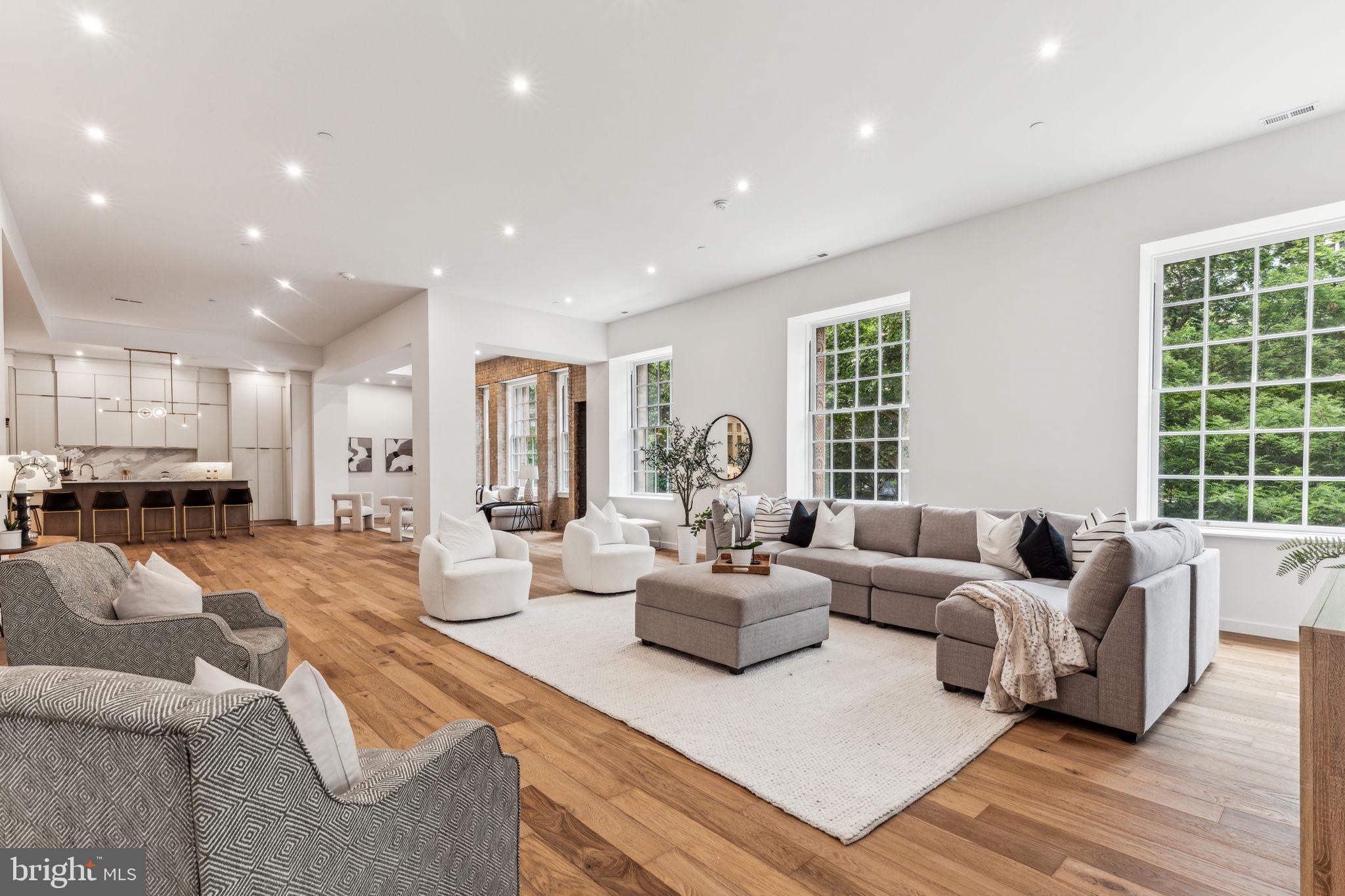 Brand new three bedroom, three and a half bathroom showplace overlooking Rittenhouse Square. Featuring high ceilings, oversized windows atop The Square, high-end finishes and a 10-year tax abatement, this is a spectacular property in one of the most desired buildings in Center City. Enter the condominium through a gracious gallery foyer with custom lighting and well thought-out ceiling detail. Past a coat closet and powder room you step into an oversized great room with two walls of windows and sunset views directly onto Rittenhouse Square. The great room provides multiple layout options for entertaining, lounging and both casual and formal dining. The entire southern wall of the great room belongs to the chef’s kitchen with floor-to-ceiling cabinetry, a large two level island with breakfast bar, Calacatta stone countertops and backsplash, Viking commercial grade stainless steel appliances and butlers pantry with a wine refrigerator and a Miele built-in coffee maker. The primary suite is well proportioned and offers Center City skyline views, two walk-in closets, two wall closets and a hotel-quality bathroom with a double vanity with Carrara countertops, a Kohler wall hung toilet in private water closet, 67” freestanding tub, and a huge walk-in shower adorned in Calacatta and Carrara stone. The second and third bedrooms each enjoy excellent closet space and luxurious ensuite marble bathrooms. There is a laundry room with sink and stacked LG washer and dryer, hardwood floors and recessed lighting throughout. Residents of The Estate Homes at Parc Rittenhouse enjoy two secure elevators for only 20 homes which provides direct access to the garage, lobby and amenities floor, in addition to the same amenities as the other homes at Parc Rittenhouse, including a 24 hour doorman and concierge; landscaped 7th floor rooftop with outdoor pool, whirlpool spa, kiddy pool, and sundeck with lounge chairs; brand new state-of-the-art fitness center; conference room and media room. There is garage parking below the building for an additional fee and three amazing restaurants on the ground floor, Stephen Starr’s Parc, Devon Seafood and Via Locusta. Rittenhouse Square is ranked the 6th best neighborhood in North America by Places Rated Almanac. There are 175 restaurants and 199 retailers within a three block radius. Within close walking distance to the Market Street office corridor, The Avenue of the Arts and University City. 30th Street Station and Philadelphia International Airport are only minutes away.