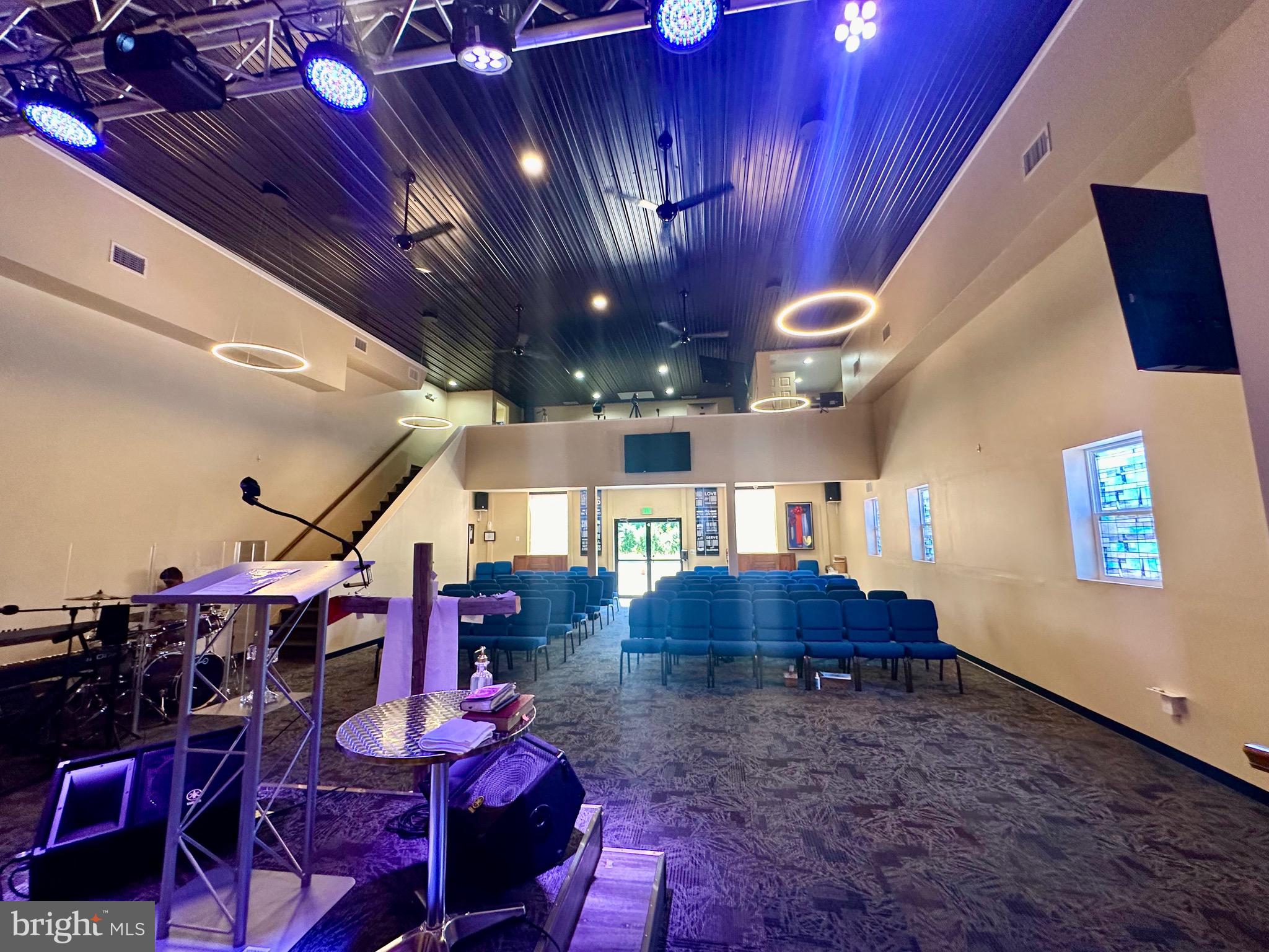 Baltimore County prime location - New contemporary spacious Building with an open sanctuary space, balcony area including two office spaces, designer carpet tiles, stage area with designer, lighting/ceiling fans. The ceiling in the sanctuary is 18 to 20 ft. high. A hallway connects to the original completely renovated building, including a new roof/lighting rod, new glass block, windows, new carpeting, and freshly painted. The Building also includes three offices, a warming kitchen fellowship hall, a women’s bathroom with 3 stalls, a separate handicapped bathroom, a men’s bathroom with 2 stalls, and a urinal. The new shed conveys a private security fence at the rear.
Additionally, this property has many other uses. This property is currently used as a church with plenty of parking available. The acreage of the lots is .28 and .61; the Building's square footage is over 5,000 + with additions/new buildings. Call for your private showing Today! (Agents see note in agent remarks) Multiple offers have been received. (The Offer deadline is January 6, 2025, 4:00 p.m.) Submit the highest and best.