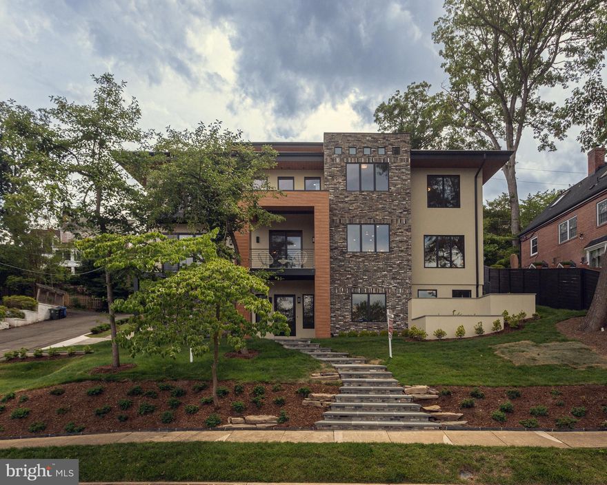 Introducing a Luxurious Masterpiece in Arlington - Pentagon City - National Landing!  Welcome to a home that embodies opulence and offers unparallel views of the iconic Washington Monument and The Capitol.  This exquisite 4-story residence boasts over 6000 square feet of pure luxury, complete with an Entry Level featuring a 2-car garage and an elevator that connects all 4 levels!  
*Step inside and discover a world of refined elegance.  The Entry Level greets you with a Formal Office, a versatile Great Room and guest quarters featuring a spacious bedroom and lavish bathroom.  The convenience of a Mudroom with a Powder Room ensures effortless organization.
*Prepare to be captivated as you ascend to the Main Level, designed to be an entertainer's dream.  A grand entrance leads to a Formal Dining Room where you can host memorable gatherings.  The luxurious Gourmet Kitchen adorned with top-of-the-line Jenn Aire appliances, an oversized kitchen island and contemporary cabinetry provides the perfect space for culinary delights.  A Pantry Room and a Butler's Pantry add an extra touch of convenience.  The Breakfast Room and Great Room beckon you to relax and enjoy moments with loved ones.  Open the oversized sliding doors to the front veranda flooding the entire floor with natural light and creating an inviting ambiance.
*As you make your way to the Bedroom Level a haven of tranquility awaits.  The expansive Owner's Bedroom Suite will leave you in awe, boasting a magnificent Master Bathroom featuring dual shower heads, body sprays and a self-standing soaking tub for ultimate relaxation.  Three additional bedrooms, including a suite with 12-foot ceilings and two bedrooms connected by a Jack and Jill Bathroom, provide ample space for family.  To enhance your convenience, a full Laundry Room is located on the same level.
*Prepare to be amazed as you reach the crown jewel of this meticulously crafted home - the Fourth Floor Rooftop Lounge.  Here, entertainment reaches new heights!  A rooftop bar with a support wet bar, dishwasher and refrigerator awaits, allowing you to effortlessly host unforgettable gatherings.  Step onto the enormous Rooftop Patio and be mesmerized by the breathtaking views of Washington DC.  This is the epitome of luxury living!
*Don't miss this rare opportunity to own a high-end, luxurious home in Arlington!  Sophistication and incomparable views merge seamlessly at this unique home.  Contact us now to make this extraordinary residence your new home and experience a lifestyle that is truly one of a kind!