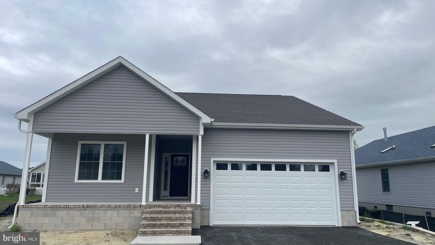 JUST 3 MILES FROM FENWICK ISLAND - Construction is underway - MAY Completion.  This stunning new home features three bedrooms and two full bathrooms. The open floor plan offers a spacious kitchen with a large island, quartz countertops, stainless steel appliances, and luxury vinyl plank flooring in the main living areas. The bedrooms are carpeted for added comfort. Enjoy the convenience of a large two-car garage and the charm of a lovely front porch, complemented by a SCREENED PORCH at the rear of the house. 

LOW TAXES:  The property is located in Sussex County, and there are no additional municipal or city taxes.

AMAZING HOA - The low HOA fee includes a community swimming pool!  The well-maintained, established community is located on  Rt54, just 3.5 miles from the beach in Fenwick Island and North Ocean City, MD!  Weekly rentals are allowed.
 

Quality construction:

Exterior Walls: Stick-built with 2"x 6" exterior walls set at 16" on center, ensuring exceptional strength and durability.

Foundation: Constructed on a 5-course block foundation with a conditioned crawlspace for enhanced comfort and energy efficiency.

Porches: Features a front porch adorned with decorative rowlock brick for added elegance.  A screen porch is located on the back of the house.  

Driveway: Includes a blacktop driveway, providing a smooth and durable surface.

Lot and Location Details:  A small portion of the lot is located within a floodplain, but rest assured, the home is not in the floodplain. Please refer to the attached survey for detailed information.

This property combines quality craftsmanship with modern amenities, making it the perfect choice for your new home.  Photos are another property constructed by the builder but represent similar finishes.