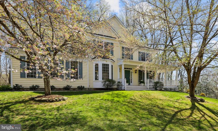 Remarkably stylish colonial is situated on 2.4 private acres on quiet cul-de-sac in popular neighborhood bordered by towering trees and green space. Total kitchen, laundry, and bath renovations, recent HVAC upgrades, and 2015 roof replacement assures this home is move-in ready. Contemporary elements and timeless lux and fine finishes include solid oak hardwood floors, heated tile and marble bathroom floors, custom cabinetry, designer fixtures, unique architectural details, tray ceiling and extensive millwork. Stunning two-story foyer with elegant staircase opens to the formal dining room and living room leading to study and impressive family room with gas fireplace, soaring ceiling, and Palladian windows framing tranquil scenic views. The impressive white gourmet kitchen features Cambria quartz and stone quartzite counters, Miele commercial grade 6-burner gas range with griddle and double ovens, pantry, drop-zone, and one-level island with breakfast bar adjacent to wet bar with walnut wood cabinetry, wine storage and beverage refrigerator. A convenient main level laundry and mudroom opens to the generous 2-car garage with Tesla charging station. The second level is complete with primary bedroom suite with sitting room or office, two walk-in closets, spacious lux bath with two sinks, soaking tub, and shower with heated floor, plus three additional bedrooms and two baths - one ensuite bath and one shared. Perfect for in-laws or au pair, the finished walk-out basement offers bedroom five and fourth full bathroom, kitchenette, recreation room, home theater, fitness center, and abundant storage. Enjoy the covered wraparound porch at sunset, Trex deck and fabulous screened porch with Infratech commercial heaters for quiet respite or alfresco dining. Venture out to woodland paths, beautiful gardens with ornamental and fruit trees, a fenced play yard and fenced kitchen garden abundant with herbs and berry bushes. Outdoor enthusiasts savor proximity to NCR Trail and Loch Raven Reservoir surrounded by miles of pristine hiking trails with historic bridges, a fishing and boating center, water vistas, and abundant wildlife. Just minutes to Hunt Valley shopping or catch I-83 for a quick commute to the Best of Baltimore.