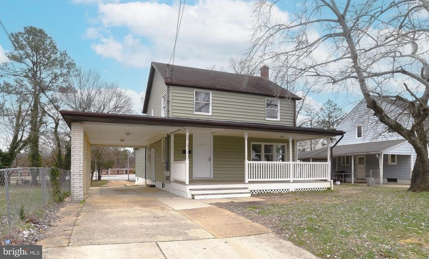 There's room for everybody in this 2,700 sq ft Pax Park Colonial! The finished lower level w/kitchen makes a great in-law suite, or rent it out for extra income! Cross the big front porch and enter into a spacious living room on the main floor that opens to the dining area and kitchen. A main floor bedroom and full bath are just down the hall. Upstairs are three bedrooms and another full bath w/tub and shower. The lower level has a separate entrance and a slider walk-up to the backyard for plenty of natural light. The space has an open kitchen, dining and living area, a bedroom, w/d, and another full bath. Under step storage, too! A double-deep carport is attached to the home and a huge detached 2-car garage is out back. There's plenty of storage above the garage or turn it into a fabulous man-cave or game room! New HVAC in 2019 and freshly painted, this home is convenient to everything and ready for you! Request your showing today!