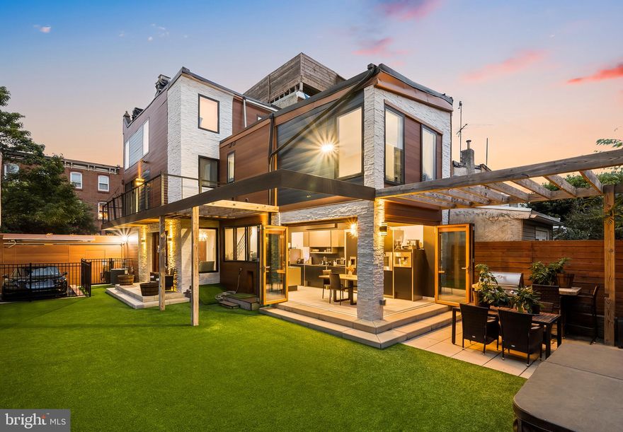 Immerse yourself in the pulse of Fishtown, as you step into this captivating California-style haven. This unique 3 bedroom, 2.5 bathroom home effortlessly melds modernity and indoor-outdoor living for a one-of-a-kind living experience.

Spanning two lots, this home boasts an expansive 35’ wide x 73’ deep presence with private parking, and an unbelievable side yard with unthinkable appointments like an outdoor kitchen, hot tub, outdoor shower, and artificial turf - a low maintenance yard solution, and green year-round place to let your canine friends run free. Inside, a sleek Euro kitchen with cabinets by Poggenpohl and a full suite of Gaggeneau appliances takes center stage, extending into the backyard through folding Nana Wall doors – a harmonious space where the boundaries between inside and outside fade away. The kitchen meets a spacious and modern living space with a stone wall, gas fireplace, powder room, and natural light from three exposures.

The primary suite boasts a private balcony overlooking the backyard, a modern walk-in closet by California Closets, and a marble bathroom with a high-pressure shower. A second bedroom and full bathroom are just down the hall. The third floor is an incredible, sun-soaked space that's perfect for an additional primary suite/third bedroom or an amazing flex space. The possibilities are endless; create an additional living space, an in-home gym, a yoga studio, or art studio.

Designed with dog lovers in mind, this home features waterproof and scratch proof LVF flooring throughout, and has a built-in dog door to allow your pups to go from indoor to outdoor easily. Practicality meets convenience with gated off-street parking and an EV charging station, accessible through a remote gate opener​, with the possibility for more than one car parking.

With incredibly low property taxes and West Coast flair just blocks from popular Frankford Ave's favorites of dining and entertainment, this home is your chance to have a (huge) footprint in the heart of Fishtown.