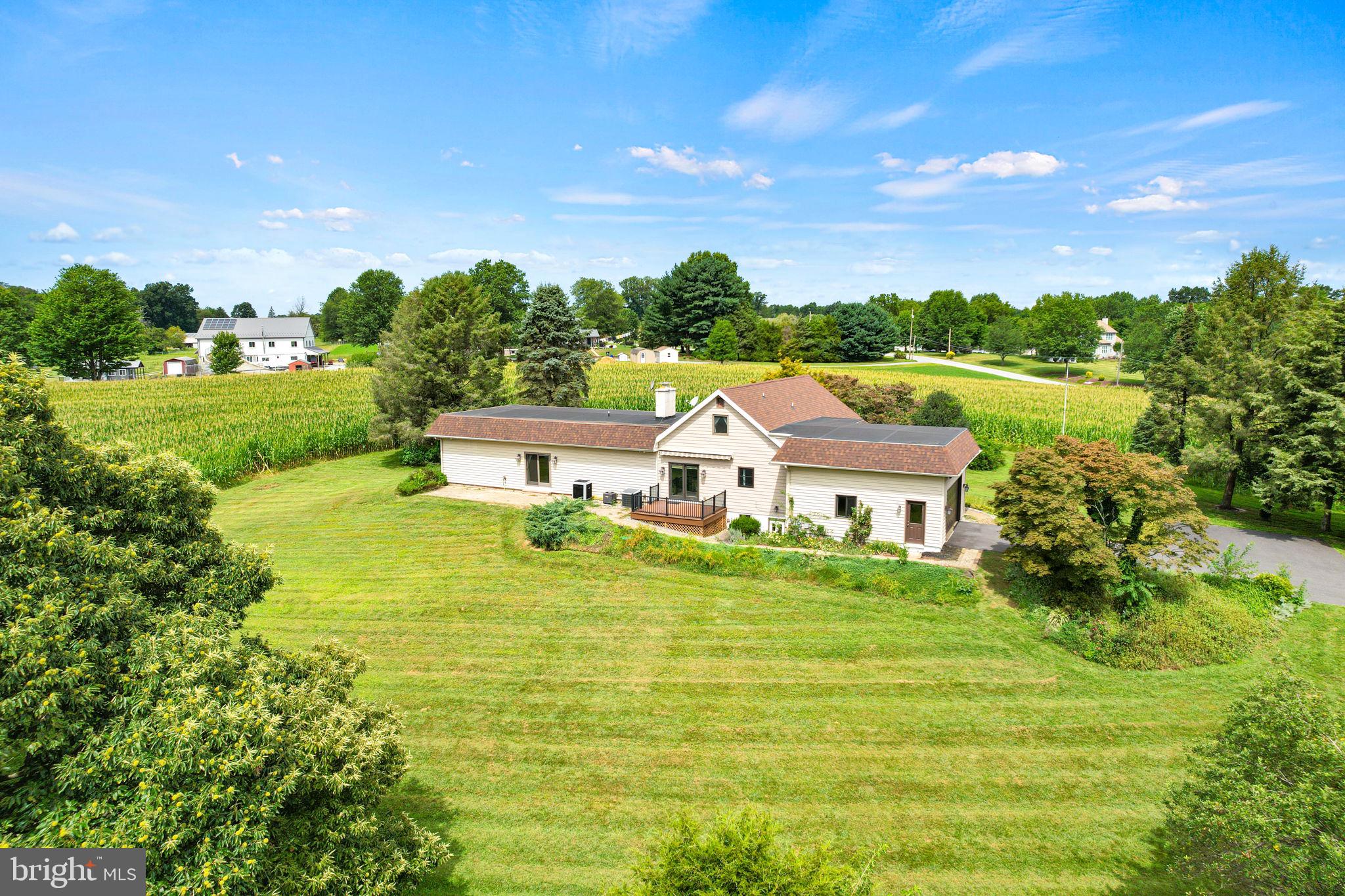 Beautifully maintained 4-bedroom, 3-bath, two-story home set on 10.98± acres along a quiet, low-traffic cul-de-sac, complete with an attached 2-car garage and a large 30’x50’ pole barn with concrete floor and electric. Most of the acreage is tillable ground, offering excellent potential for farming, gardening, or rental income. A year-round stream meanders through the property, adding both charm and natural beauty, all while maintaining convenient access to major routes.
The first floor features a sunken living room, an oak kitchen with breakfast bar, Corian countertops, and abundant cabinetry, plus a cozy family room with a fireplace and propane insert. The spacious primary suite includes a walk-in closet, handicap-accessible shower, and direct access to a private 8’x24’ patio. An additional bedroom/den/office and a full bath complete the main level.
Upstairs, you’ll find two generously sized bedrooms and another full bath, creating an ideal layout for family or guests. Additional highlights include stained interior trim, a welcoming 7’x12’ front porch/deck, and a 10’x14’ side deck perfect for relaxing or entertaining.
This property combines the comfort of a well-built, move-in ready home with the utility of a large pole barn, productive tillable acreage, and peaceful surroundings — all just minutes from major roadways.