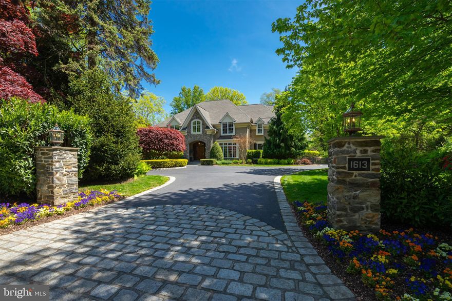 Welcome home to your private, one-acre Villanova oasis in the heart of the Main Line. This magnificent, immaculately maintained five-bedroom home with site-finished hardwood throughout is situated in an exceptional walk-to-everything location, and boasts all of the modern amenities and smart technology of a new construction home alongside the peace and tranquility of suburban living. Within walking distance to the Villanova train station, this property provides the best of Main Line living with easy access to Philadelphia. Imagine starting your morning with coffee on the back patio overlooking a quiet, scenic backyard and wooded sanctuary, or with a workout in the basement gym with a full bath, oversized steam shower, and radiant floors. Hop on the train to Philadelphia or go to work in one of the first floor dual home offices. Whip up dinner in the open concept chef's kitchen with an expansive marble island, Wolf appliances, instant hot water, dual dishwashers, and a Sub Zero refrigerator, while friends and family relax in the two-story family room with reclaimed beams and floor-to-ceiling stone gas fireplace. Complete the evening on the screened-in back patio with a fire in the outdoor fireplace, dinner on the built-in Wolf grill and a show on the outdoor TV -- or relax in the fully finished, window-lit basement perfect for entertaining with a wet bar, Sub Zero fridge, dishwasher, ice maker, microwave, and ample room for seating.  Updates in recent years include: a brand new master bath with custom vanities, marble countertops, free standing soaking tub, oversized frameless shower and radiant heat floors; Lutron smart lighting technology; new granite vanities and fixtures in all secondary full baths; upgraded second floor laundry, including new washer and dryer; a Sonos smart speaker system; smart home security system; a whole house generator; a Racchio wireless irrigation control system; a water softener system and whole house water filter; two instant hot water heaters; wiring for a Tesla charger; and full interior painting. 1613 County Line Road is located in the top-ranked Lower Merion School District and is move-in ready for its next owners. Contact listing agents Jennifer Rinella or Siobhan Cooney today for a private tour.