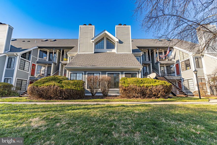 OFFER DEADLINE: Monday, April 7, 2025 at 5 PM

Welcome to Tiers II at Manchester Lakes! This completely renovated 2-bedroom, 1-bath condo is nestled in the charming community of Kingstowne. With a main-level entrance and an assigned parking space just steps from your front door, convenience meets comfort in this beautifully updated home.
Step inside to discover a tastefully redesigned interior featuring an open living and kitchen area, highlighted by a cozy fireplace. Freshly painted walls, recessed lighting, and a neutral color palette create a warm and inviting atmosphere throughout. The eat-in kitchen showcases elegant light gray cabinets with oil-rubbed bronze fixtures and accents, complemented by a stylish backsplash, quartz countertops, and stainless steel appliances.
The spacious primary bedroom easily accommodates a king-sized bed and features a large walk-in closet, coffered ceiling, and ceiling fan for added comfort. The second bedroom, which doubles as a sunroom, boasts vaulted ceilings and abundant natural light, making it a bright and airy retreat. The bathroom has undergone a complete transformation, boasting a newly tiled shower with a custom glass door, a modern vanity, mirror, new fixtures, and flooring. For added convenience, this home includes an in-unit washer and dryer. Step outside to enjoy the serene pond view, backing to a large community space.
Residents of this community have access to a wealth of amenities, including a clubhouse, gym, large outdoor pool, tot lot, basketball court, and volleyball court, providing endless opportunities for leisure and recreation. Located just minutes from Kingstowne Town Center, you’ll have access to a wide variety of dining options, shopping, entertainment venues, and grocery stores, making everyday living a breeze.