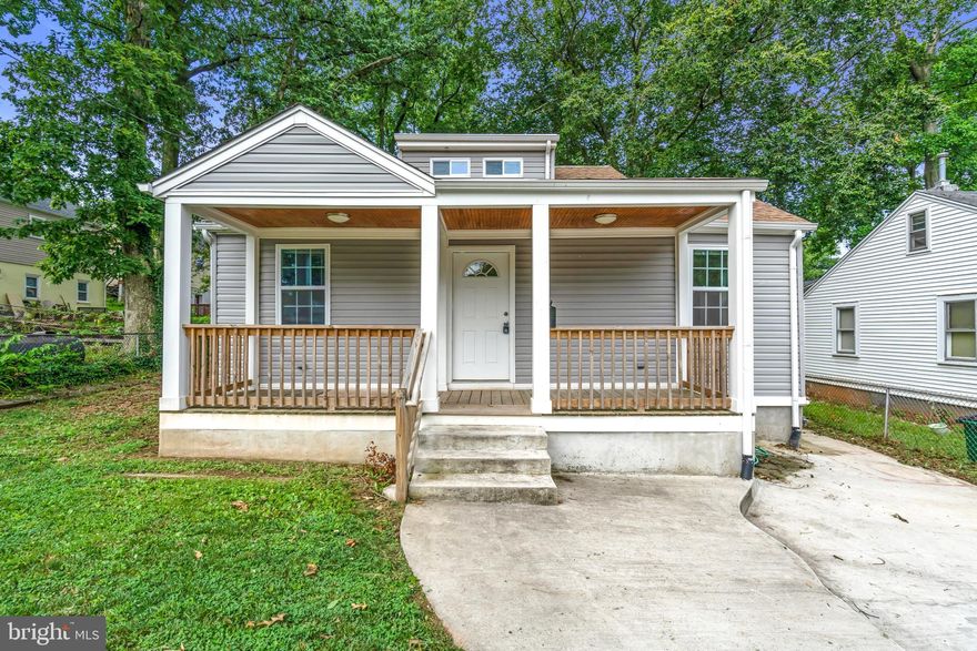 Fully renovated from top to bottom. Spacious 6 Bedroom, 3 bath home boasts updated lighting,gourmet kitchen, living room, hardwood floors (excluding bedrooms), washer/dryer, finished walkout basement, off street parking, and huge backyard.