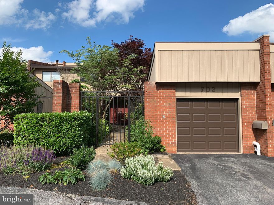 Price Adjustment!  This bright, beautiful, spacious 4 BR, 3.5 Bath townhome with garage is move-in ready!  Large master bedroom with vaulted ceiling, master bath, walk-in closet, and deck overlooking peaceful green common area.  The splendid eat-in kitchen offers abundant storage and counter space.  There is a fireplace in the sun filled living room and a second deck.  The lower level is finished with a family room, 4th bedroom, and full bath.  New carpeting throughout the second level!  Conveniently located!