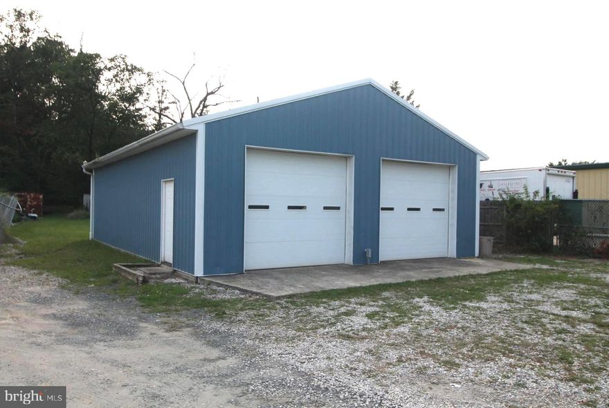 Zoning CECLI.  1200 square foot 2 door garage with vehicle lift and air compressor system.  Home is 1 bedroom, 1 bathroom with 2nd and 3rd bedroom and bathroom options.  House is in livable condition but property is being sold as-is.  Property was commercially appraised at 467k in 2019.  The year the house was built is estimated.
