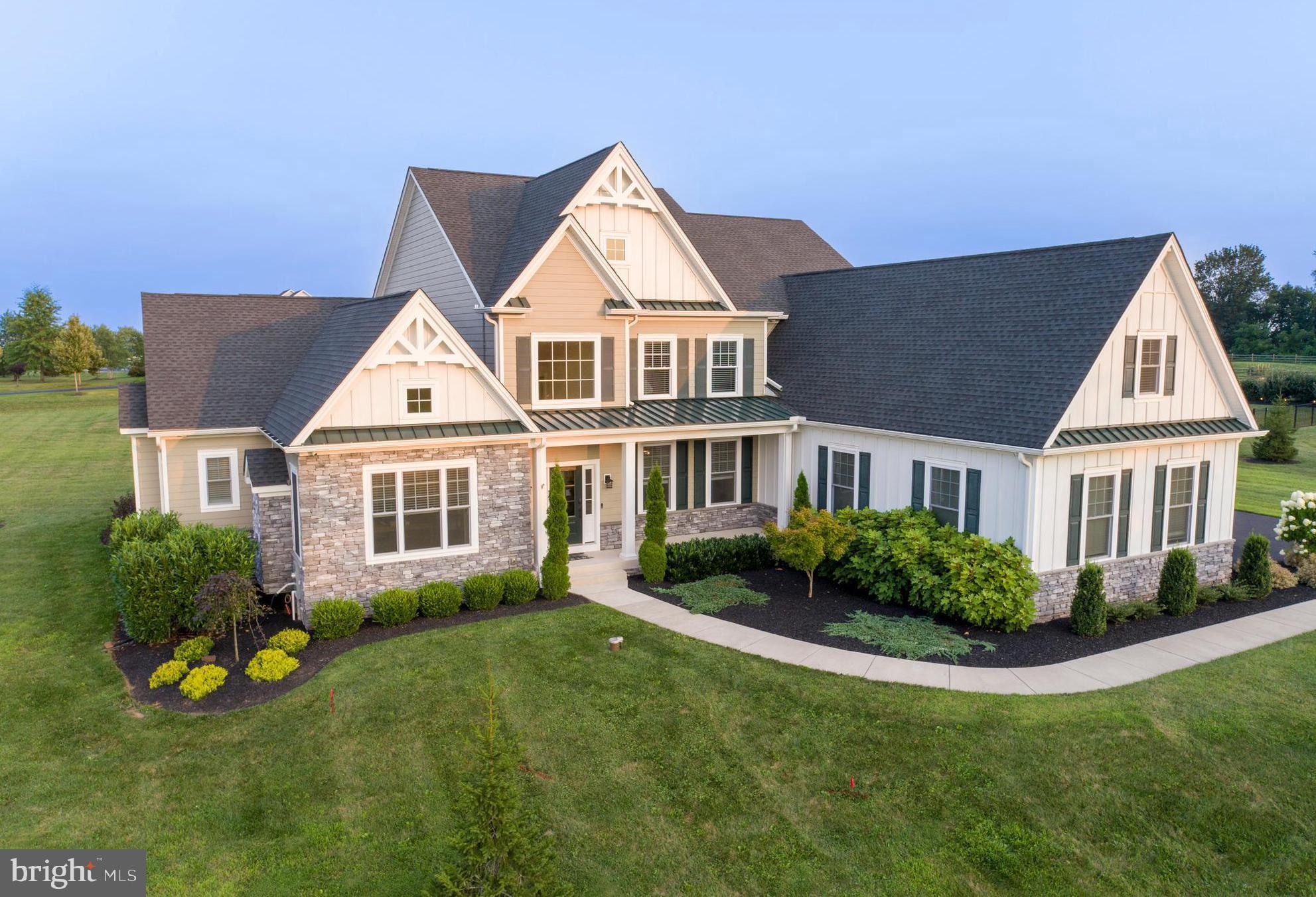 Welcome to 1161 Upper Stump Road, a stunning 4-bedroom, 5.1-bath luxury estate within short biking distance to Lake Galena and Peace Valley Park and just minutes to downtown Doylestown. This masterfully designed home combines timeless architectural details with today’s most sought-after upgrades, creating an ideal blend of elegance, comfort, and function. Every inch of the home has been thoughtfully designed — craftsmanship shines in the coffered ceilings, upgraded millwork, wide-plank hardwood floors, multiple fireplaces, and smart home technology with 9-zone Sonos audio, surveillance, and remote access to lighting, doors, and garage systems. The gourmet Eat-In Kitchen stands as a true centerpiece — combining style and performance with fully custom cabinetry, built-in LED lighting, and professional-grade appliances including a 60” dual-fuel Wolf range with double griddle, Subzero 648Pro refrigerator, Subzero wine fridge, under-counter beverage coolers, Wolf hood, convection microwave, and more. An oversized double-thick granite island anchors the space, offering seating, storage, and a striking visual focal point. The first floor Primary Bedroom En-Suite is a true sanctuary, with its vaulted ceiling accented by custom wood trim, cozy electric fireplace, and an expansive custom walk-in closet. The spa-inspired Primary Bath offers heated floors, a soaking tub with custom surround, dual vanities with built-in appliance storage, and a private water closet. A dual-entry shower with multiple body jets and independent shower heads delivers a resort-like experience, while premium finishes throughout elevate every detail. Each of the three remaining upstairs Bedrooms have their own en-suite Bathroom, ceiling fan, and ample closet space. Don’t forget to check out the enormous 3rd Bedroom Bonus Room/Loft space complete with custom woodwork, recessed lighting, and bright dormers. The 2,400 sq. ft. finished lower level is designed for unforgettable entertaining, styled as an authentic Guinness themed Irish pub with a custom walnut bar, tin ceiling, brass foot rail, and built-in LED lighting. Enjoy a movie in the Dolby 7.1 surround theater, work out in the gym, or host guests at the fully equipped bar with Perlick beer dispenser, Subzero beverage refrigerators, ice maker, and more. Outdoor living is equally impressive, with a covered patio featuring a fireplace, built-in TV, ceiling fans, and integrated audio. The property’s 2.54 acres are beautifully positioned for entertaining and recreation, with berms along the rear and side yards for added privacy. There are so many more amazing rooms, features, and useful upgrades in this home that we simply couldn’t fit them all in this description. Please refer to the attached detailed list of upgrades and features for the complete picture of everything this remarkable property offers. With easy access to Philadelphia, New York, and all that Bucks County has to offer, this is an extraordinary home in a truly exceptional setting.