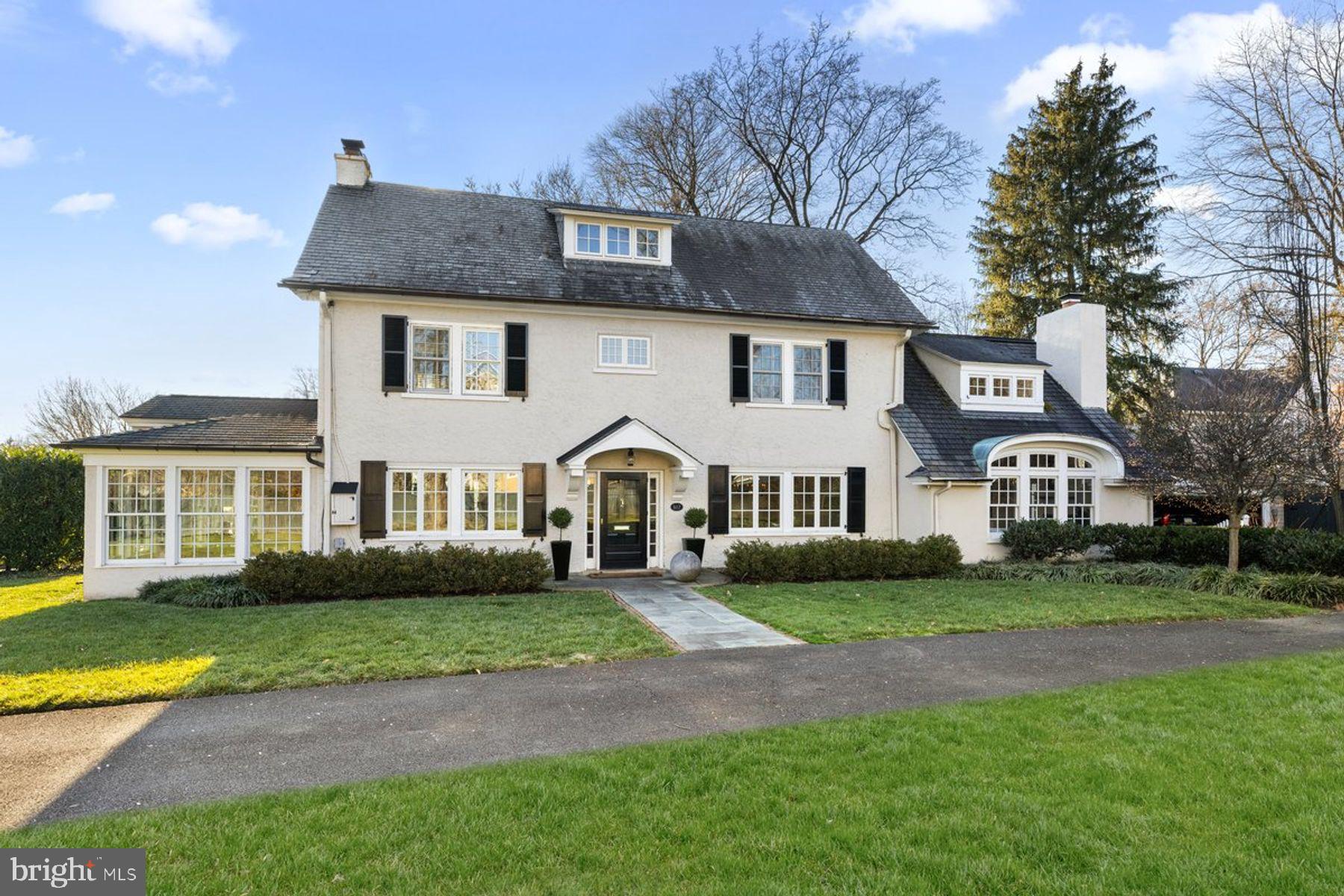 Welcome to 517 Willow Grove Avenue in coveted Wyndmoor. This bright and beautiful center hall colonial, with the coolest of vibes, has been perfectly curated by the current owner. Pull into the long, private driveway beyond the green wood fence and you are instantly relaxed as you take in the lush landscape with mature gardens. Enter the home through the front door into the foyer and notice the straightforward layout with gleaming hardwood floors, deep windowsills, and charming details throughout. To your left, step into the bright welcoming living room and adjacent sunroom. These rooms share a fireplace, which lends to the breezy feel. The sunroom, with radiant floor heat and surrounded by windows, will be your new favorite place to start your morning routine or finish the day with a cocktail from the built in bar. On the other side of the home, you'll find the dining room for formal entertaining as well as the modern open kitchen and family room with fireplace and vaulted ceilings, which is the ideal space to gather. On the second floor, there is a spacious primary suite and additional large bedroom with full bathroom. The primary suite includes a bedroom, bathroom, lots of closet space with built in storage, and an office/sitting room adjoining. The third floor has two more bedrooms with a full bathroom. The lower level offers endless storage but could easily be set up for playroom and ping pong. As for outdoor space, there is plenty! Private, secluded flagstone terrace in the rear, fire pit in the front yard and a large side yard perfect for sports, games and entertaining. Detached garage. The location is ideal, walk into Wyndmoor or Chestnut Hill and take advantage of all the local shops, restaurants, and amenities including the Wissahickon Trails. Commute to downtown Philadelphia in 30 minutes or NYC in 90 minutes. The convenience is unbeatable. This home is special and you will be enchanted by the beauty, comfort, and polished feel of 517 Willow Grove Avenue!