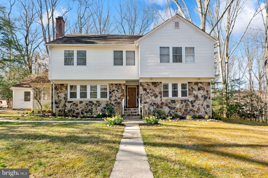 Welcome to this amazing home in the peaceful, sought-after neighborhood of  Springbrook Forest. This home boasts an open floor plan with beautiful hardwood floors throughout the main level, a  large dining room, living room with a fireplace, a breakfast nook, large family room with access to the deck, two-half baths and a large mudroom accessible from the garage.  The upper level offers the owners' suite, and 4-additional bedrooms with 3-baths and the washer/dryer.   The basement has options for a playroom, office or an in-law suite with living room and a full bath.  This home backs-up to over an acre of nature with mature trees and a peaceful and serene setting, perfect for entertaining or relaxing on the deck.  This home is located  within close proximity to  houses of worship, transportation, grocery stores, parks and trails.